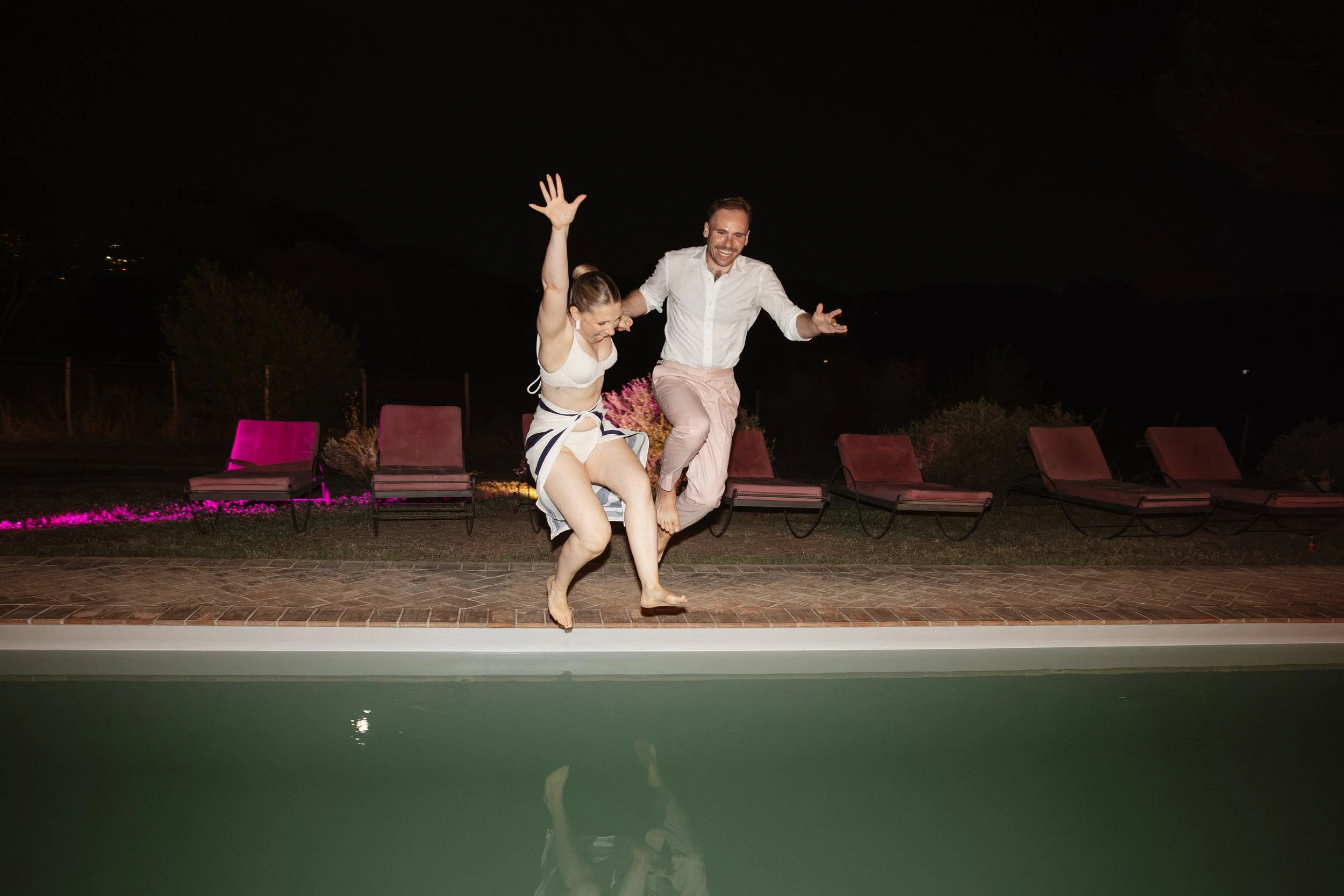 Selina, Jamie and their guests dancing, enjoying ice cream and jumping into the pool at Casale del Gallo during a relaxed Italian summer wedding party.