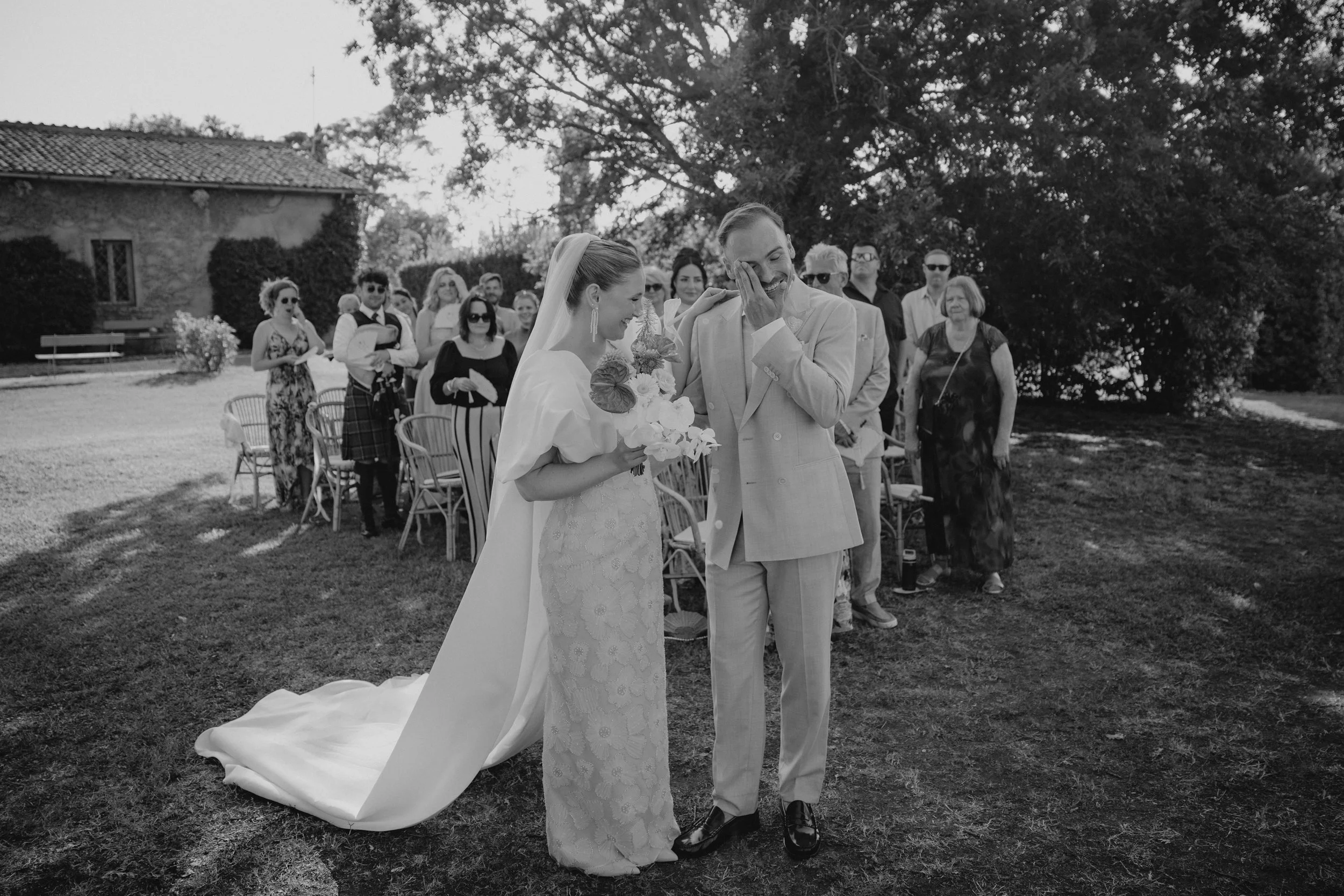 Elegant outdoor wedding ceremony at Casale Sant’Antonio near Rome, with Selina and Jamie exchanging personal vows during their Italian destination wedding.