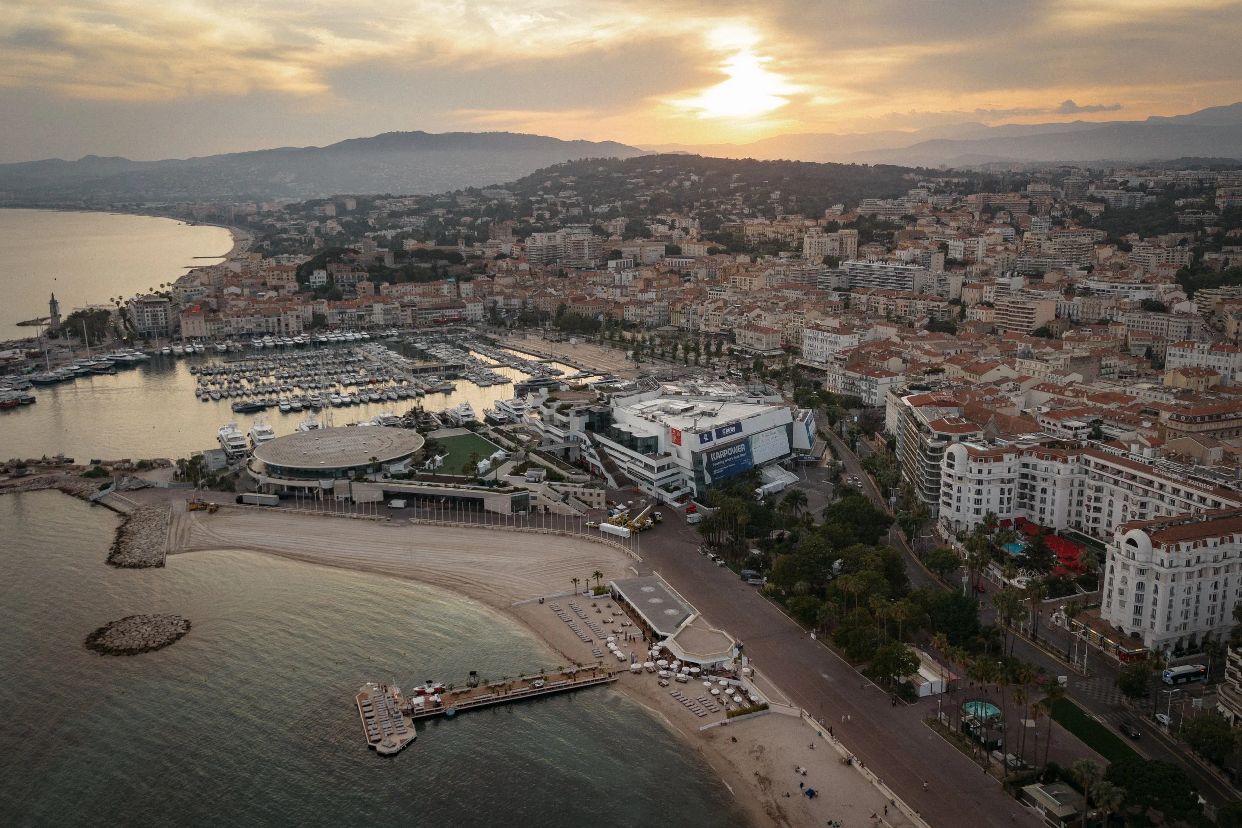 Luxury wedding dinner and reception by the Mediterranean Sea in Cannes, featuring elegant tablescape design, white florals, heartfelt speeches, candlelight, and an intimate celebration on the French Riviera.