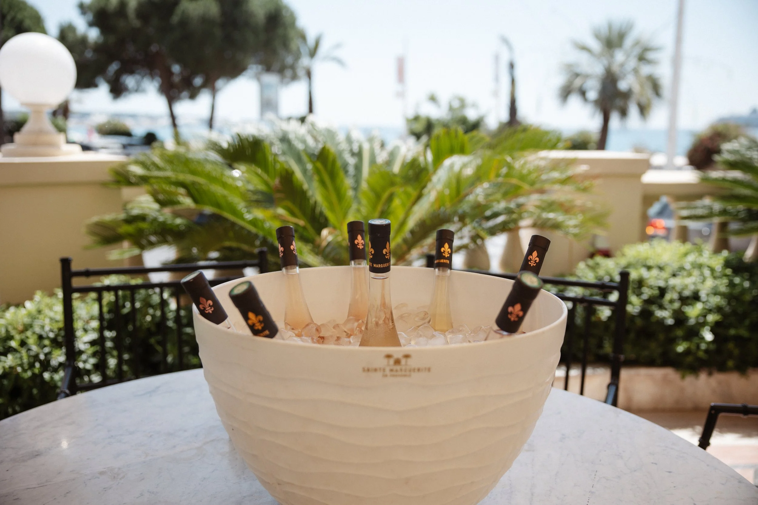 Elegant wedding lunch and cake cutting at the iconic Carlton Cannes, where family and friends celebrated together in a timeless setting on the French Riviera during a luxury destination wedding.