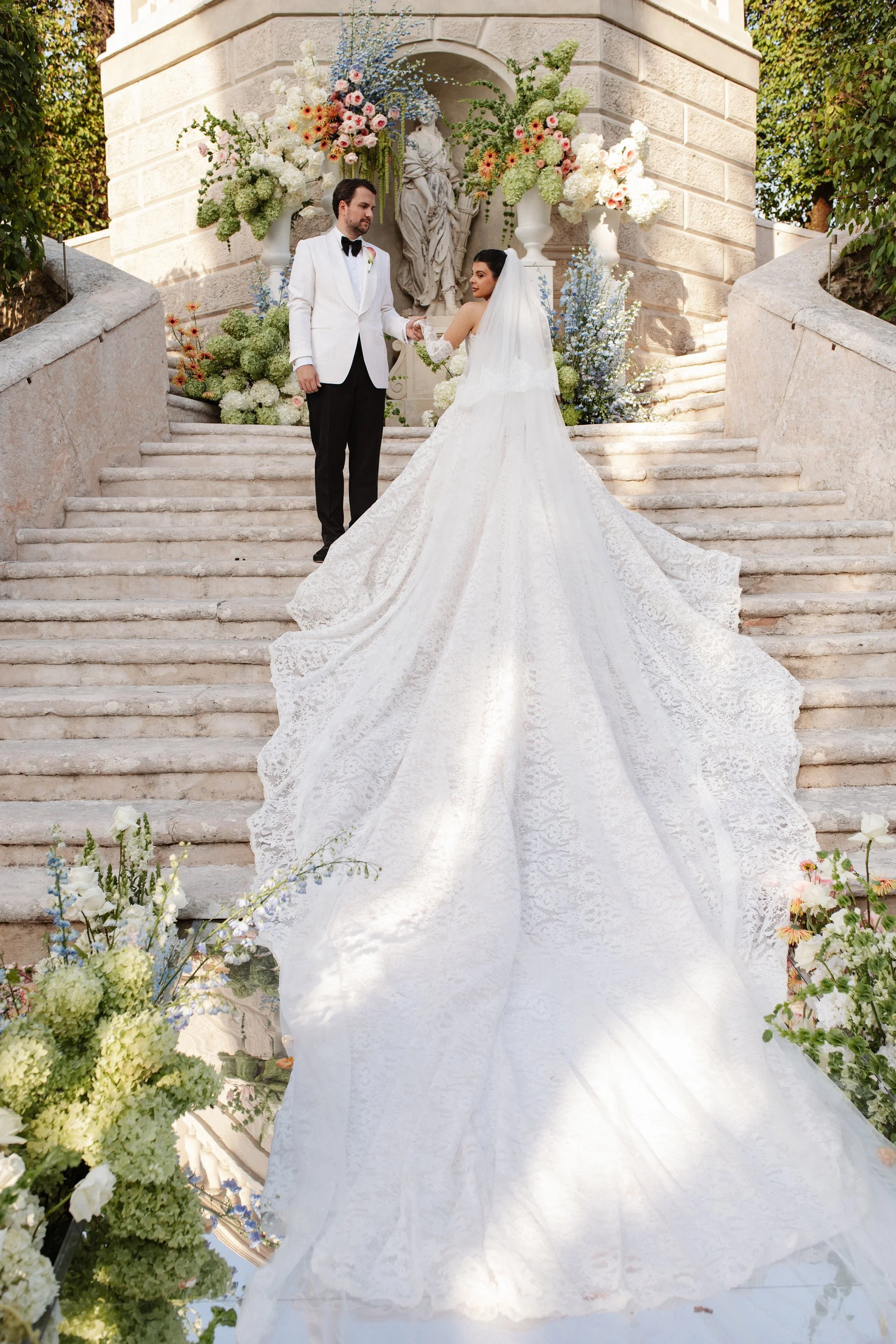 Luxury wedding ceremony in the historic gardens of Villa Rizzardi in Verona, with elegant floral styling, white details and a sophisticated Italian garden setting.