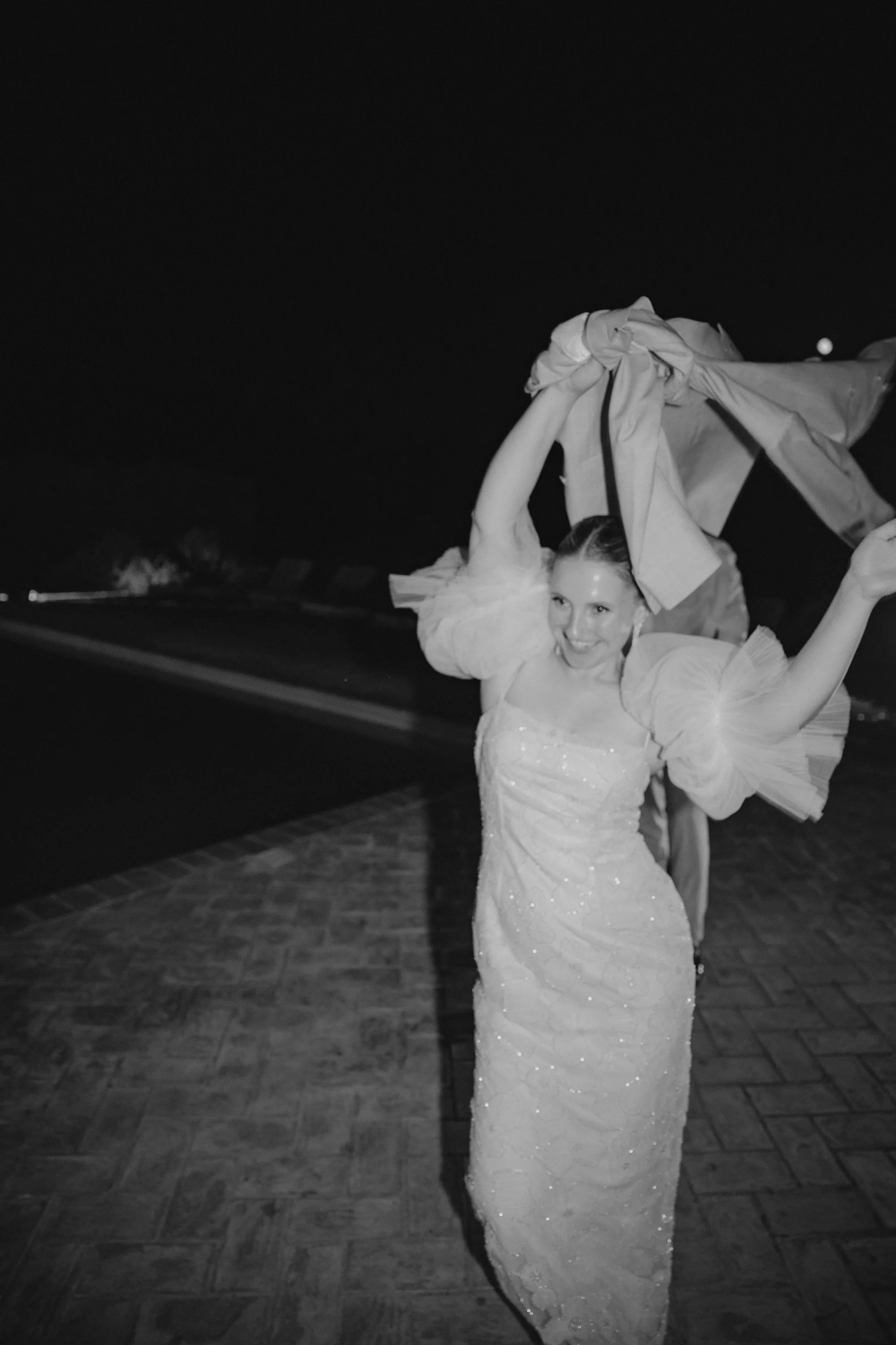 Selina, Jamie and their guests dancing, enjoying ice cream and jumping into the pool at Casale del Gallo during a relaxed Italian summer wedding party.