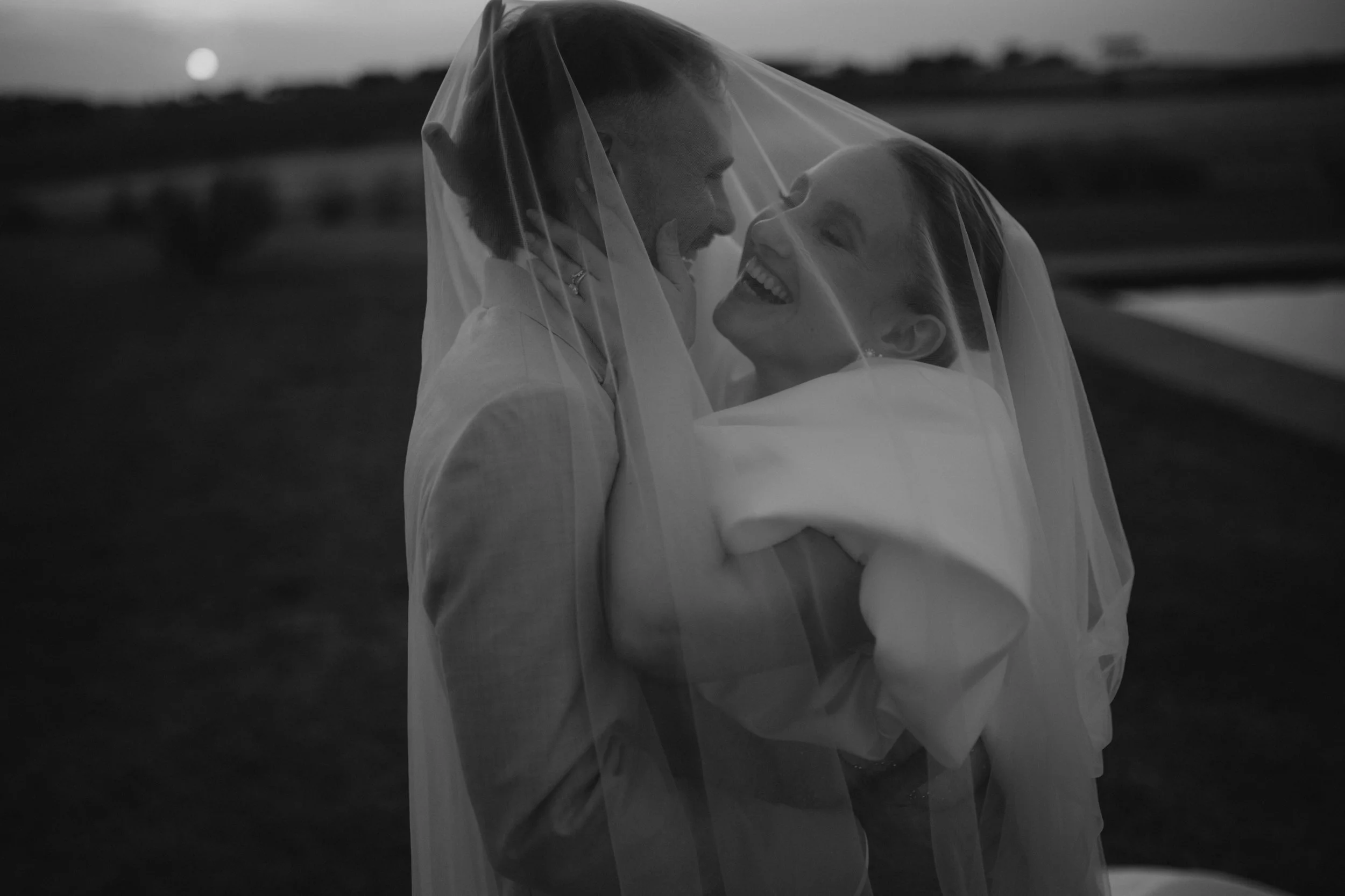 Elegant destination wedding dinner and couple portraits at Casale del Gallo near Rome, with long outdoor tables, natural floral styling and warm Italian evening light.