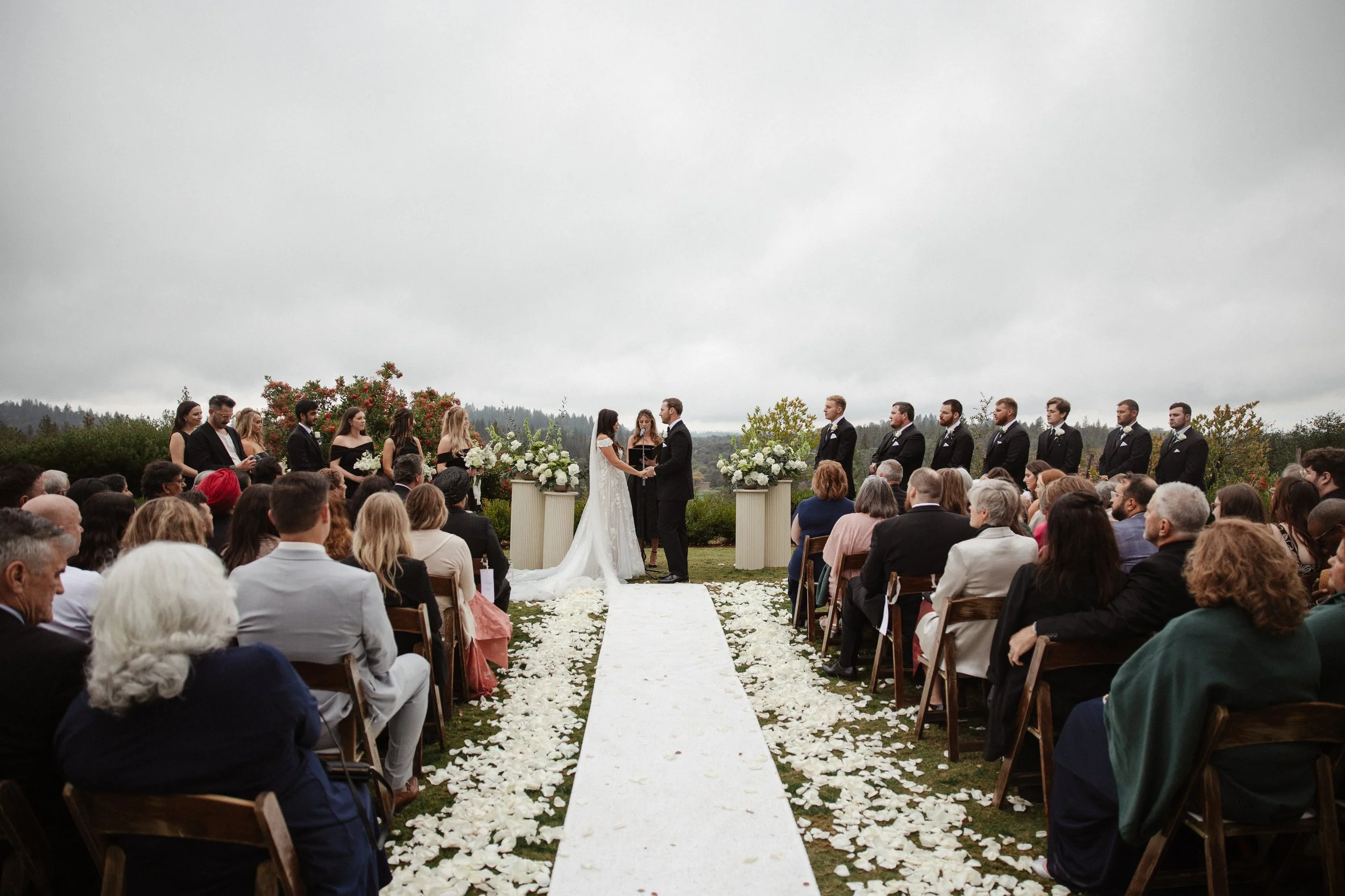 The outdoor ceremony was deeply personal and emotional. A close friend officiated the vows, making every word feel honest and heartfelt. The entrance of the bridal party, followed by Maya with her parents and Zack waiting quietly, created a powerful 