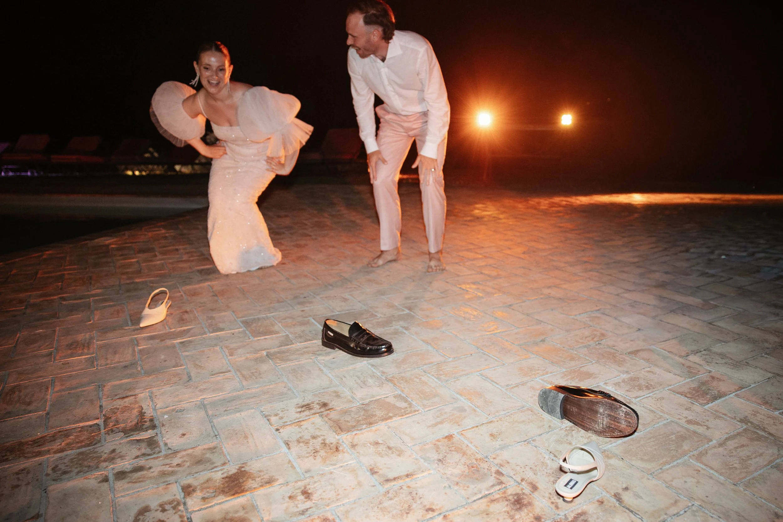 Selina, Jamie and their guests dancing, enjoying ice cream and jumping into the pool at Casale del Gallo during a relaxed Italian summer wedding party.
