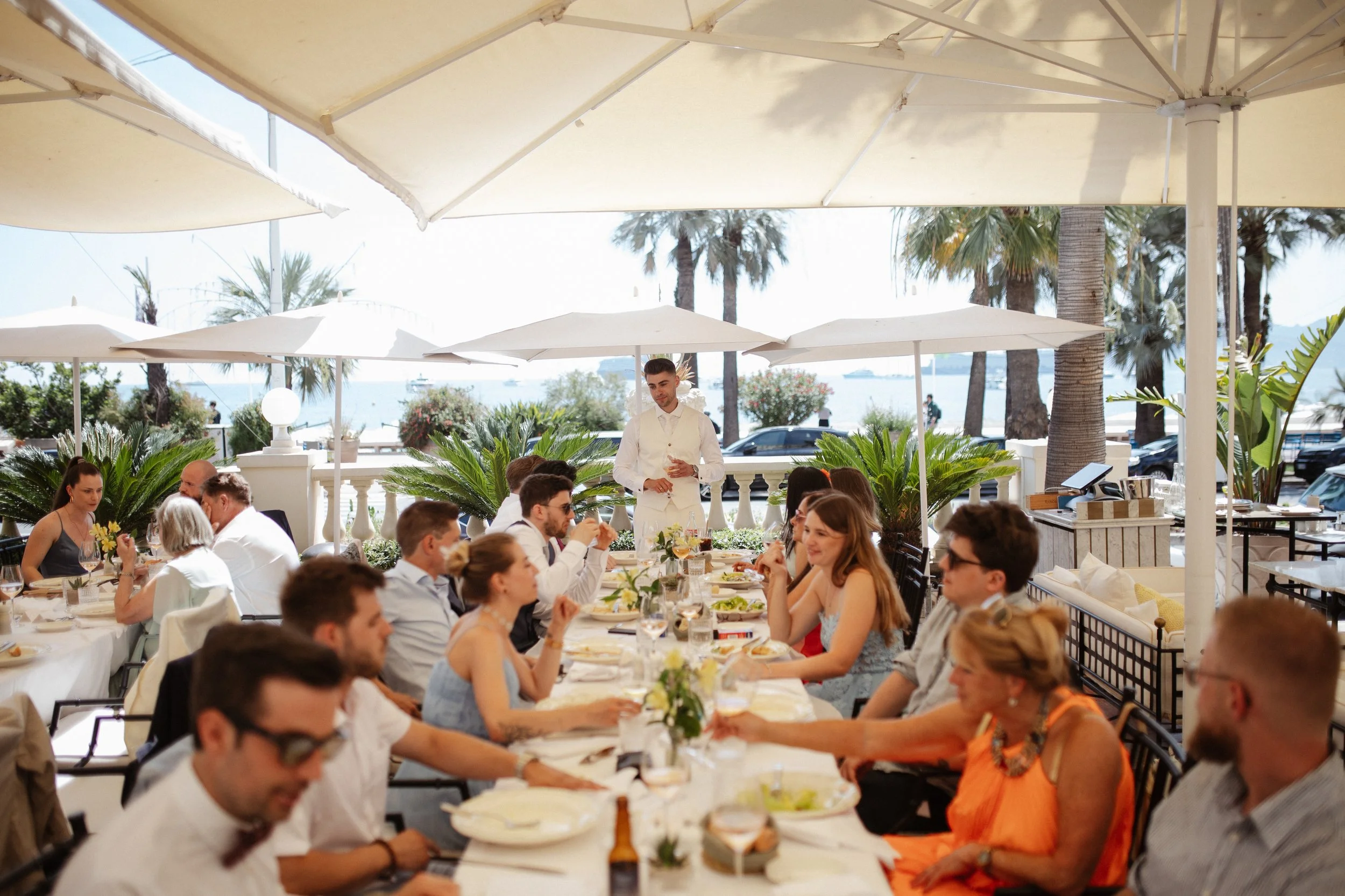 Elegant wedding lunch and cake cutting at the iconic Carlton Cannes, where family and friends celebrated together in a timeless setting on the French Riviera during a luxury destination wedding.