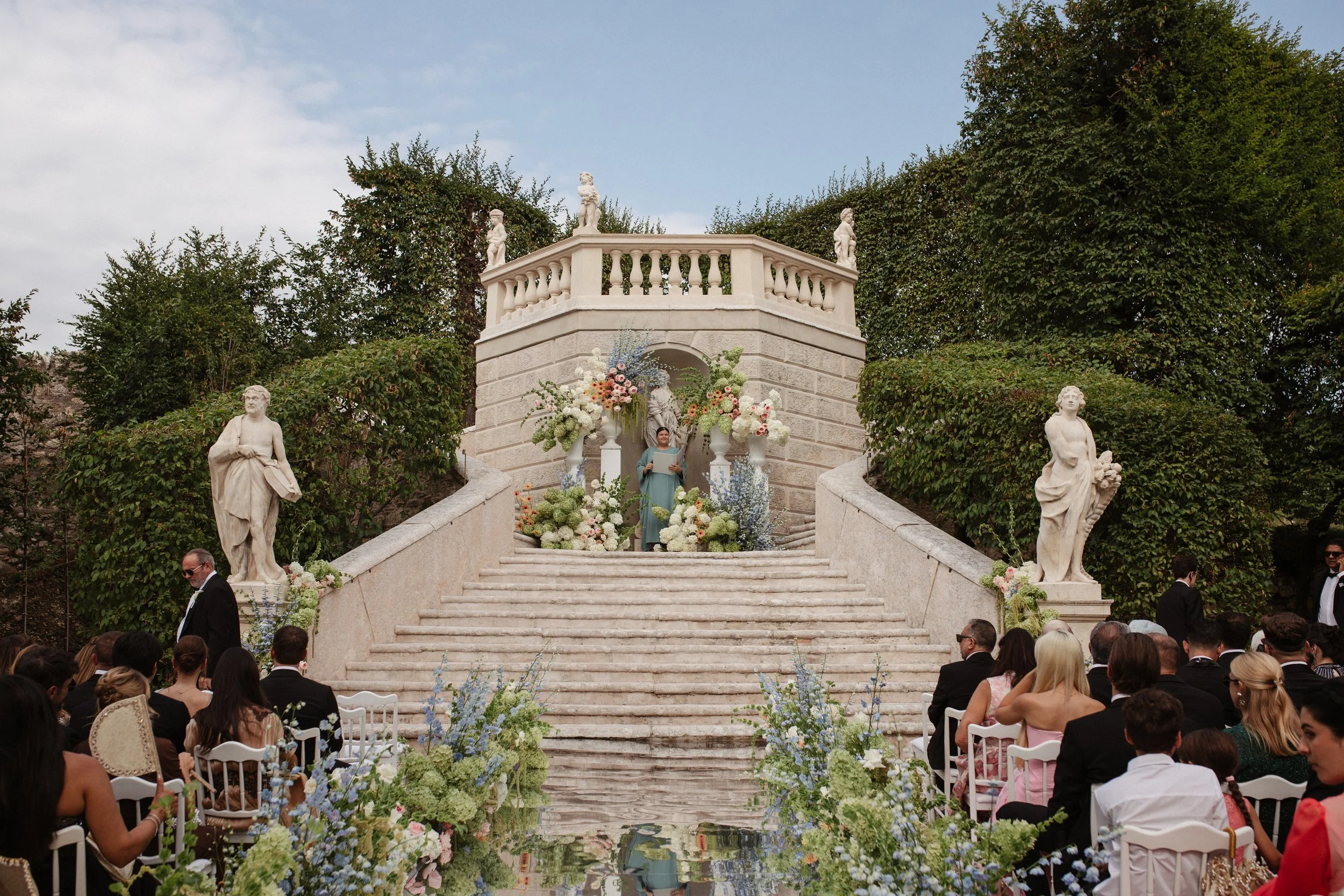 Luxury wedding ceremony in the historic gardens of Villa Rizzardi in Verona, with elegant floral styling, white details and a sophisticated Italian garden setting.