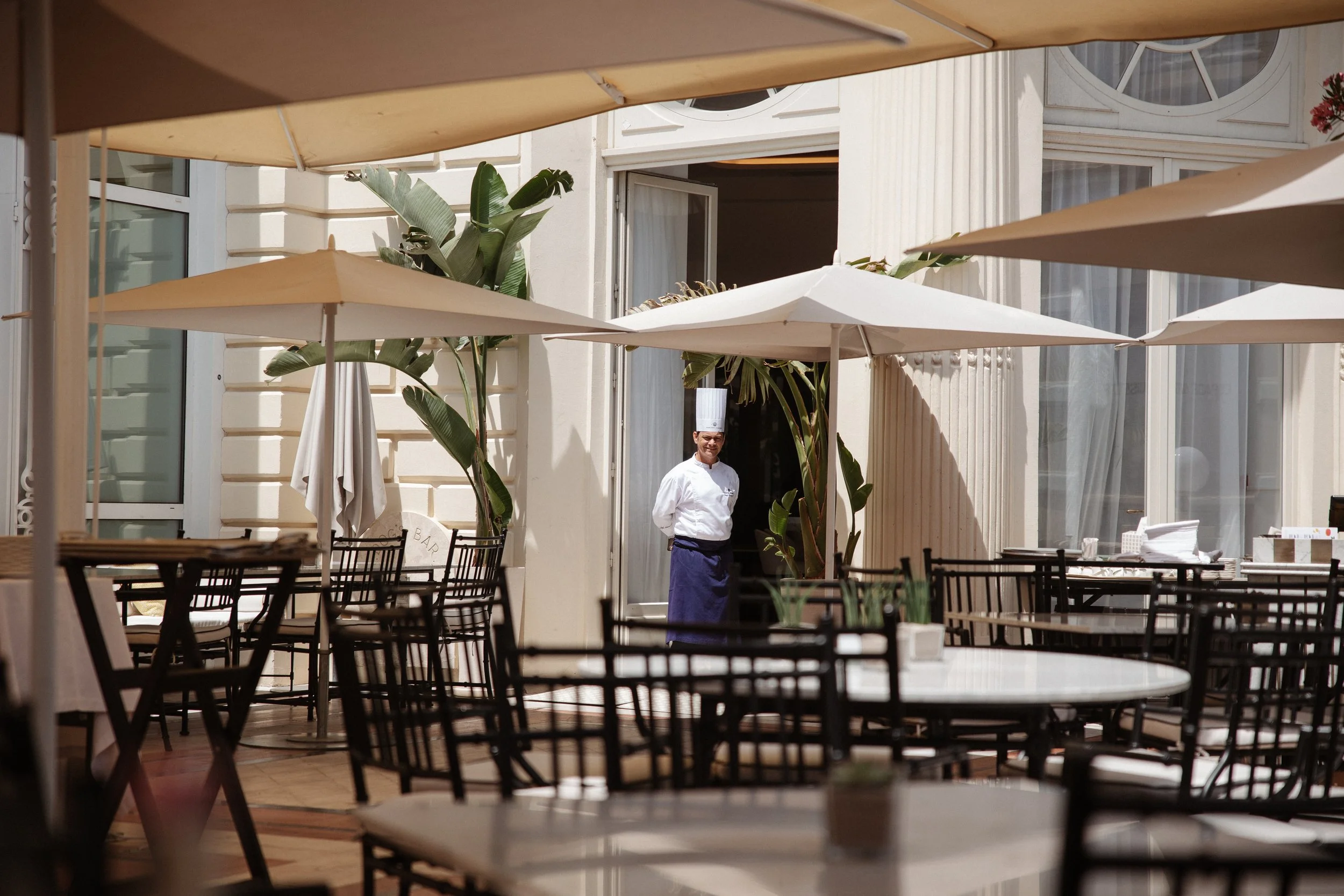 Elegant wedding lunch and cake cutting at the iconic Carlton Cannes, where family and friends celebrated together in a timeless setting on the French Riviera during a luxury destination wedding.