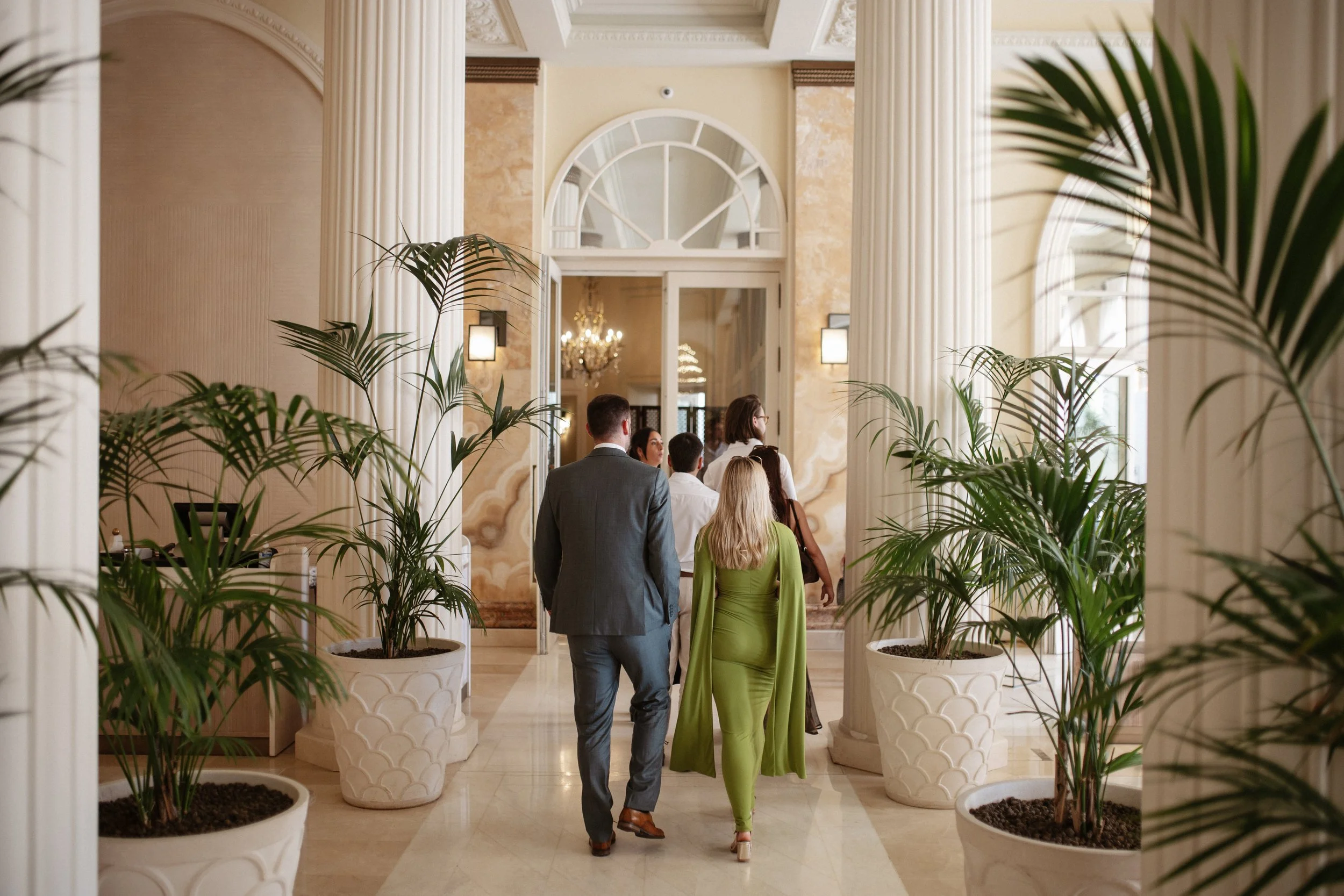 Elegant wedding lunch and cake cutting at the iconic Carlton Cannes, where family and friends celebrated together in a timeless setting on the French Riviera during a luxury destination wedding.