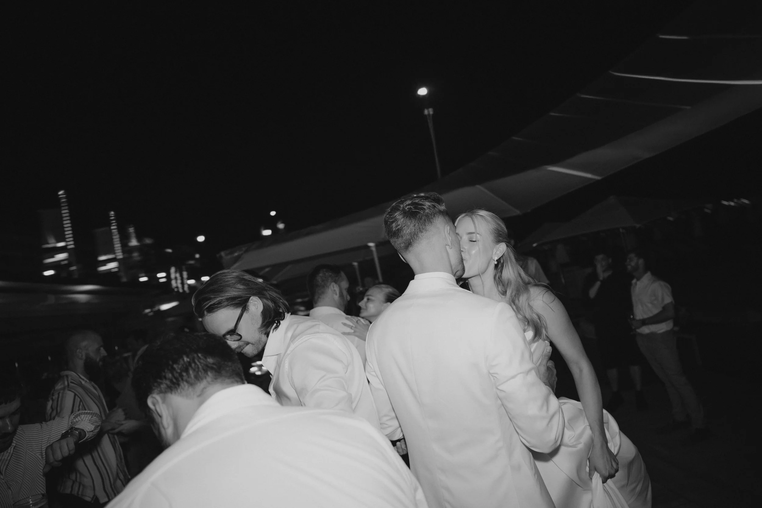 Luxury wedding dinner and reception by the Mediterranean Sea in Cannes, featuring elegant tablescape design, white florals, heartfelt speeches, candlelight, and an intimate celebration on the French Riviera.
