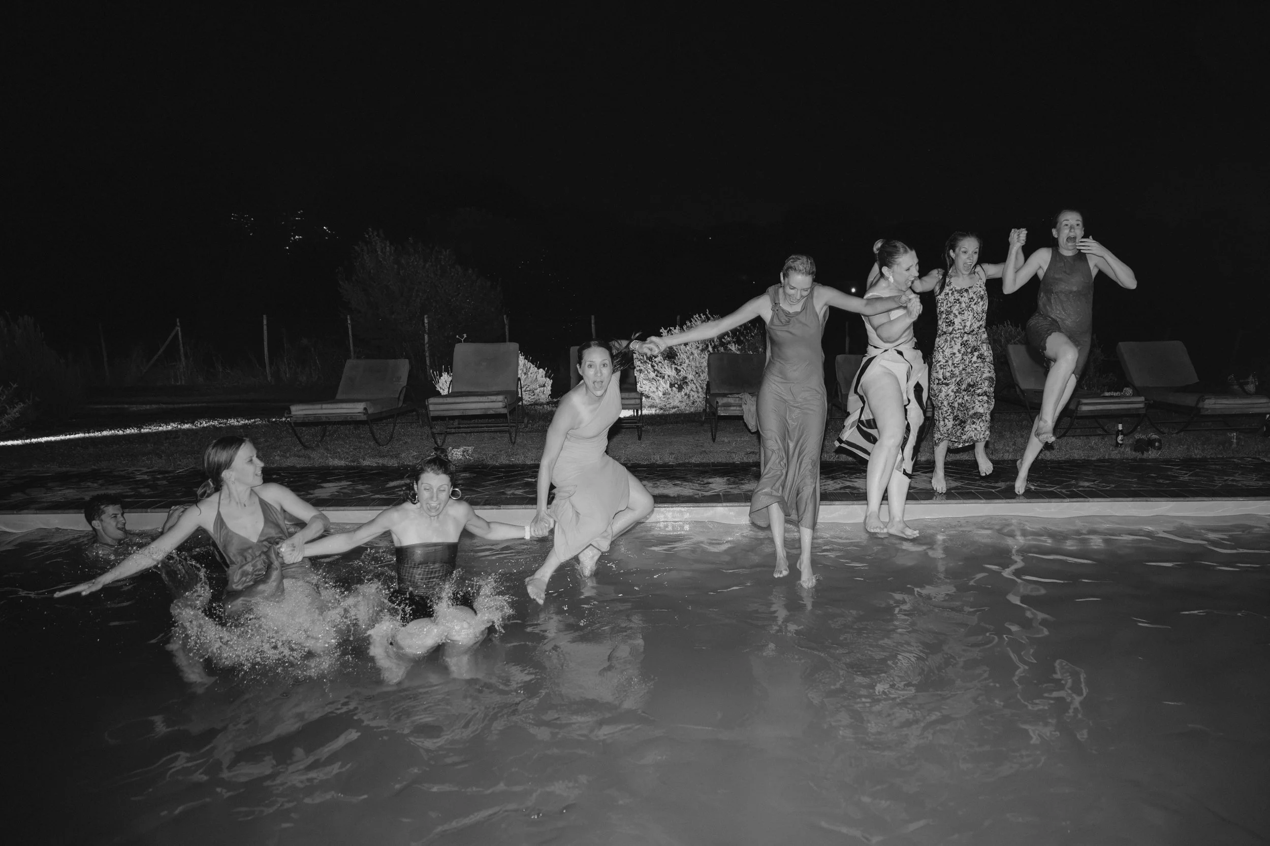 Selina, Jamie and their guests dancing, enjoying ice cream and jumping into the pool at Casale del Gallo during a relaxed Italian summer wedding party.