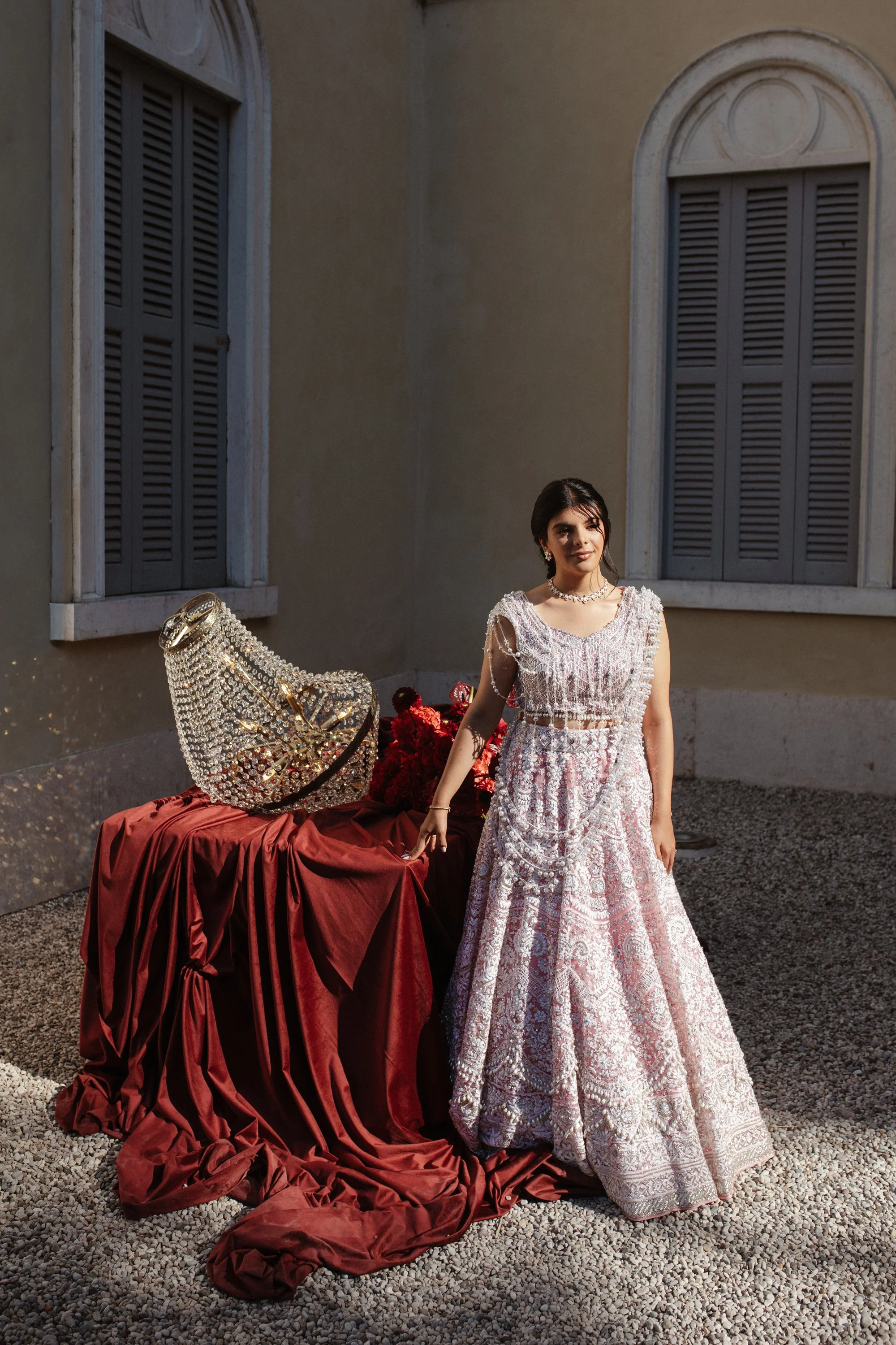 Pakistani wedding celebration in Verona at Villa Rizzardi, featuring traditional clothing, rich red and gold details, music and an elegant cultural setting.