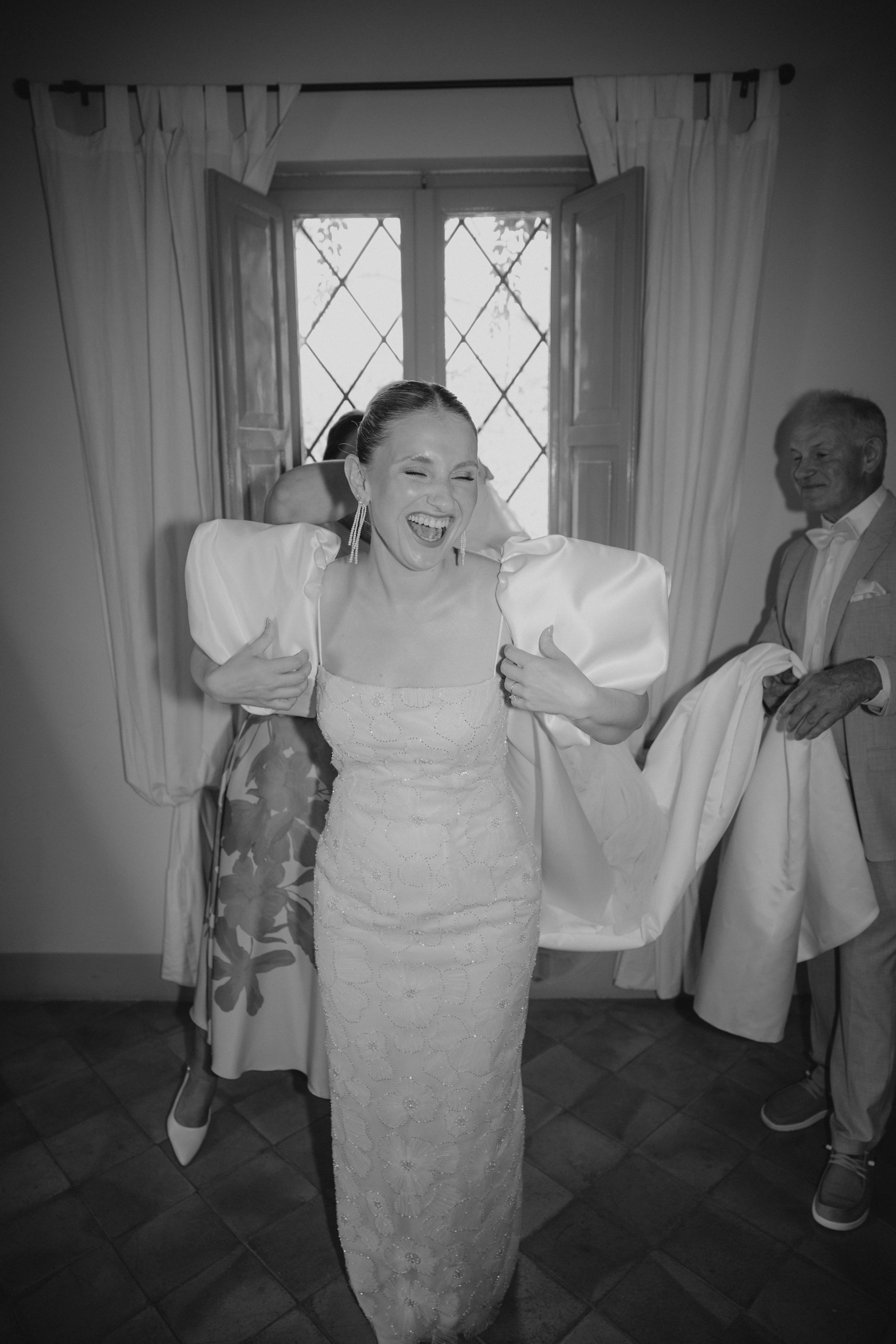 Selina and Jamie getting ready for their Italian summer wedding at Casale del Gallo near Rome, surrounded by close family and friends.