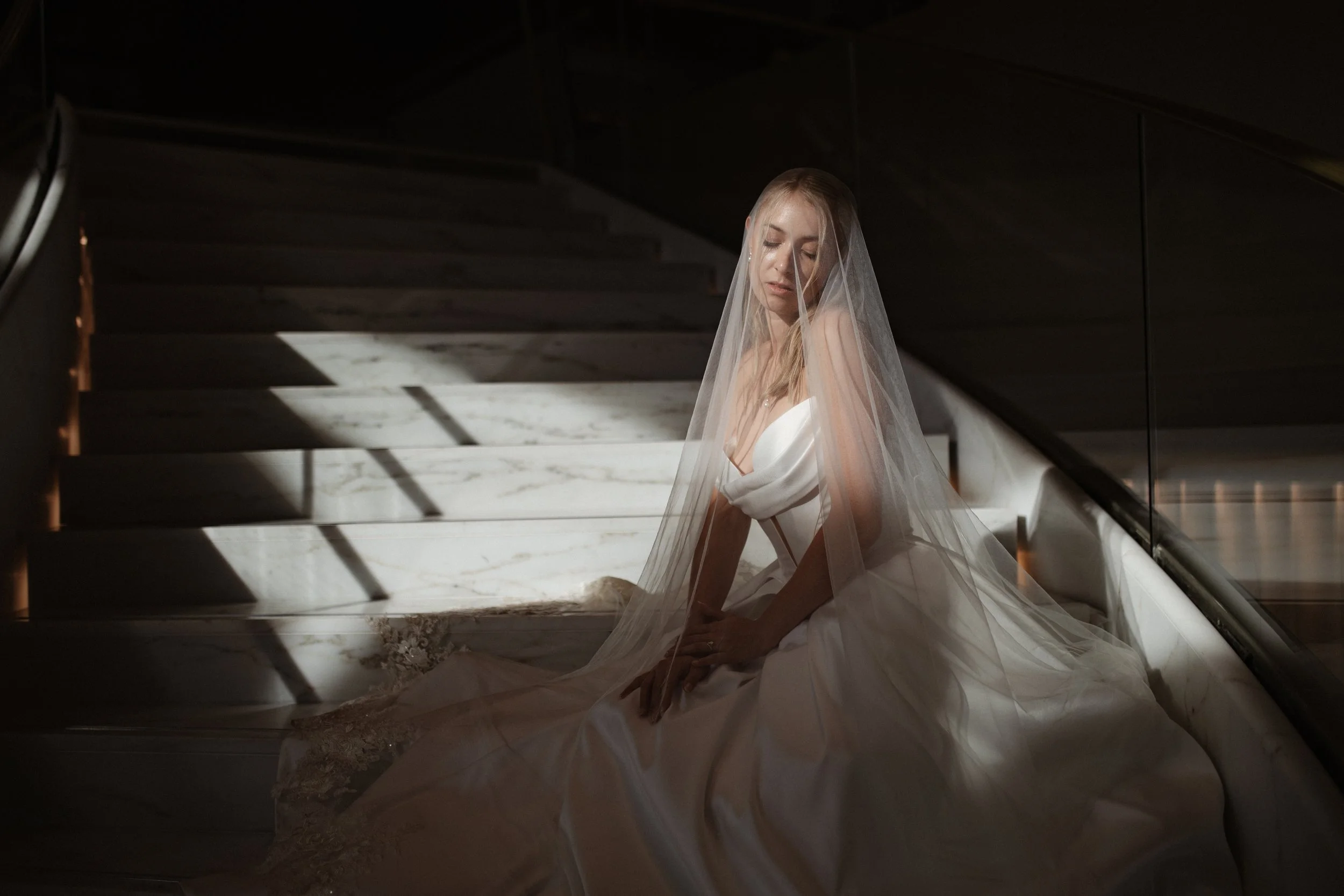 Elegant wedding portraits of the bride and groom along Boulevard de la Croisette in Cannes, featuring a white tuxedo, timeless bridal fashion, Mediterranean architecture, and the iconic French Riviera atmosphere.