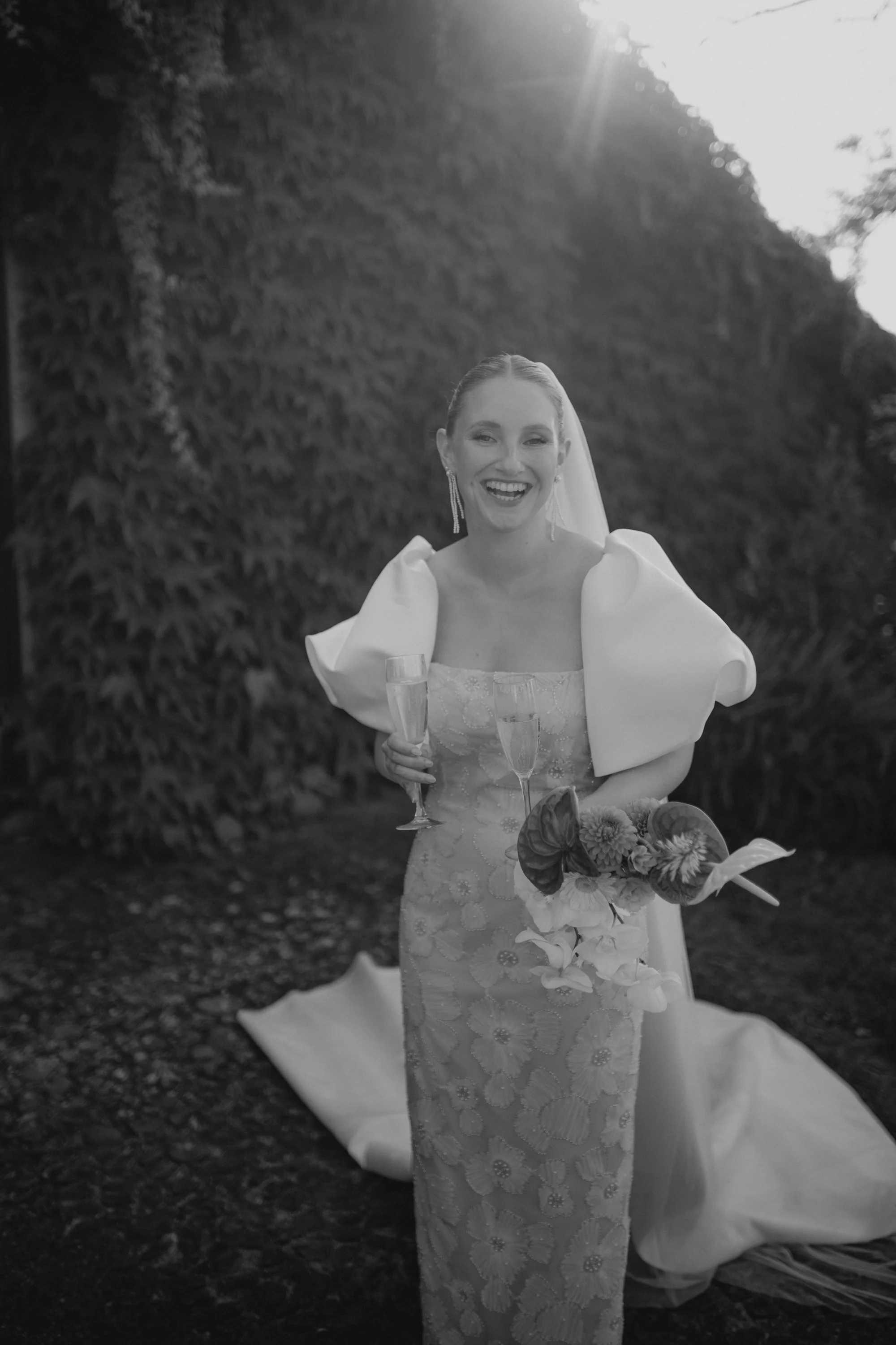 Italian summer wedding at Casale del Gallo near Rome, featuring Selina’s individual wedding dress by Lieben Achten Ehren, her statement cape and Jamie’s rose-colored suit.