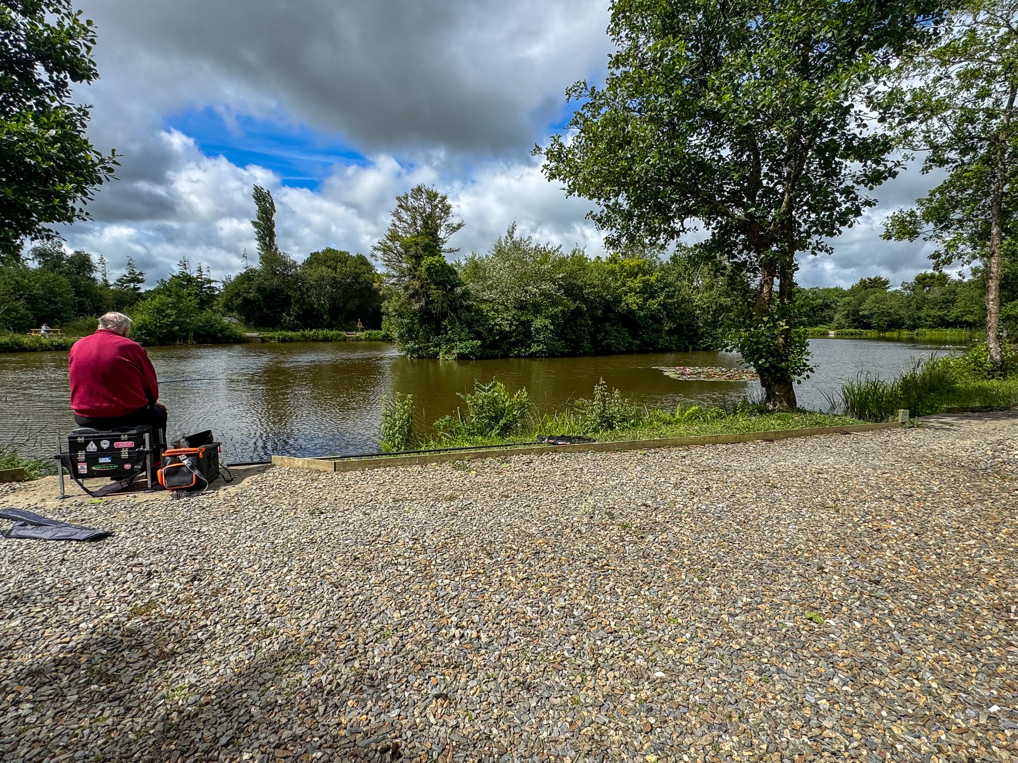 Guest fishing at one of the lakes at Bodmin Holiday Park in Cornwall.