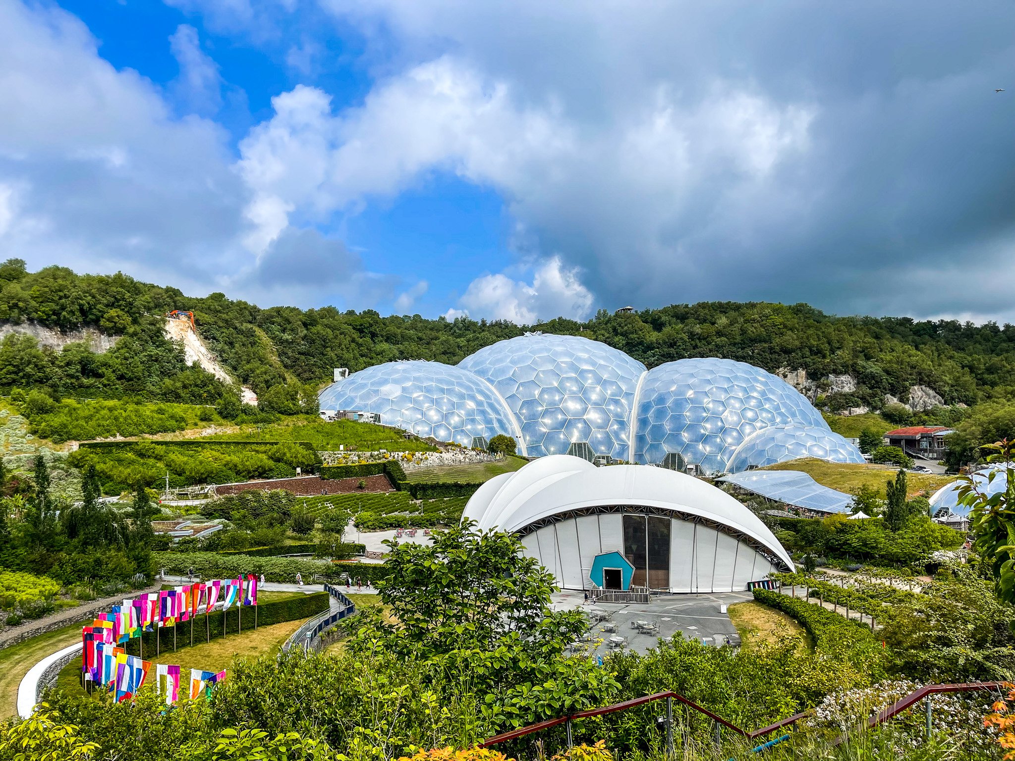 Panoramic view of the Eden Project biomes in Cornwall on a sunny day.