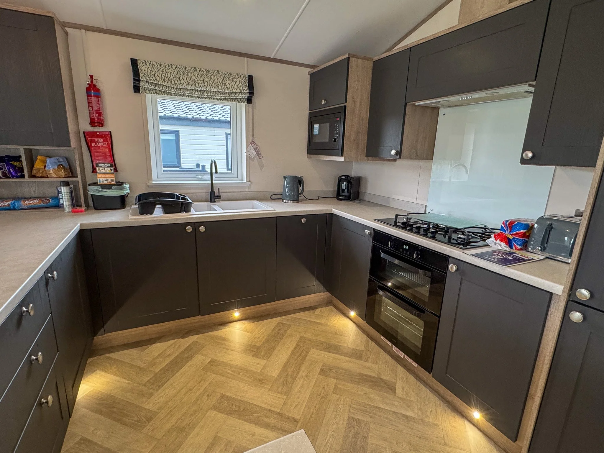 Modern kitchen inside a two-bedroom Platinum Lodge at Bodmin Holiday Park in Cornwall.