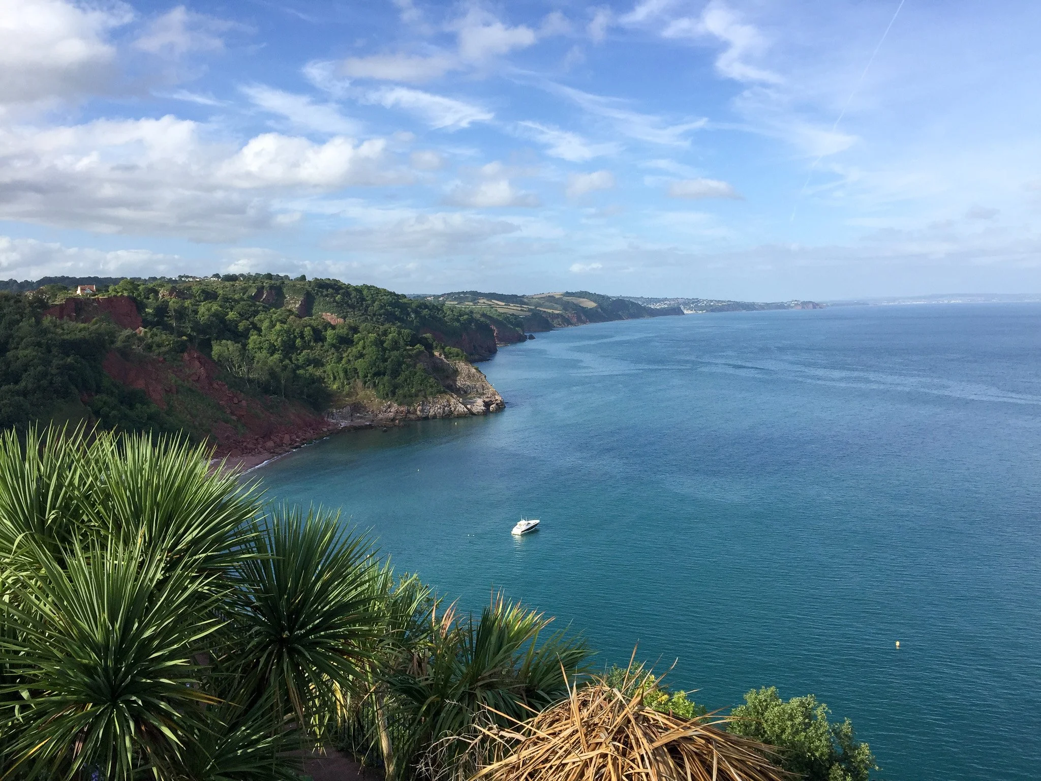 View across Babbacombe Bay in Torquay, Devon, with the sea and coastline stretching into the distance