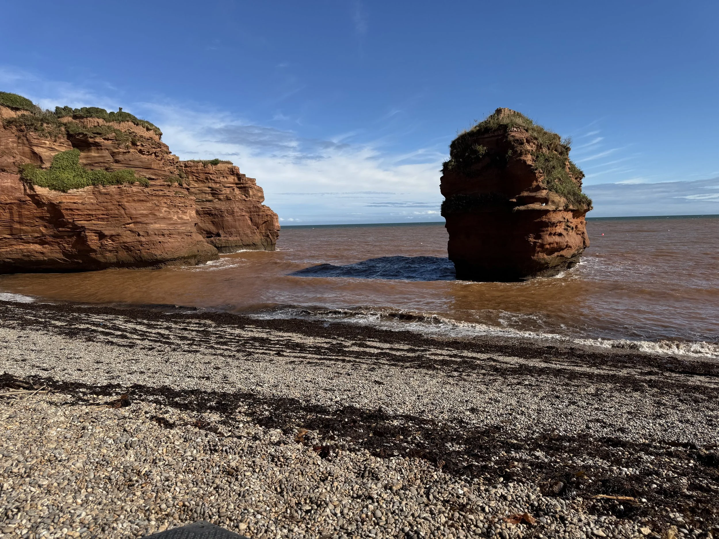 Red sandstone sea stacks at Ladram Bay beach in East Devon