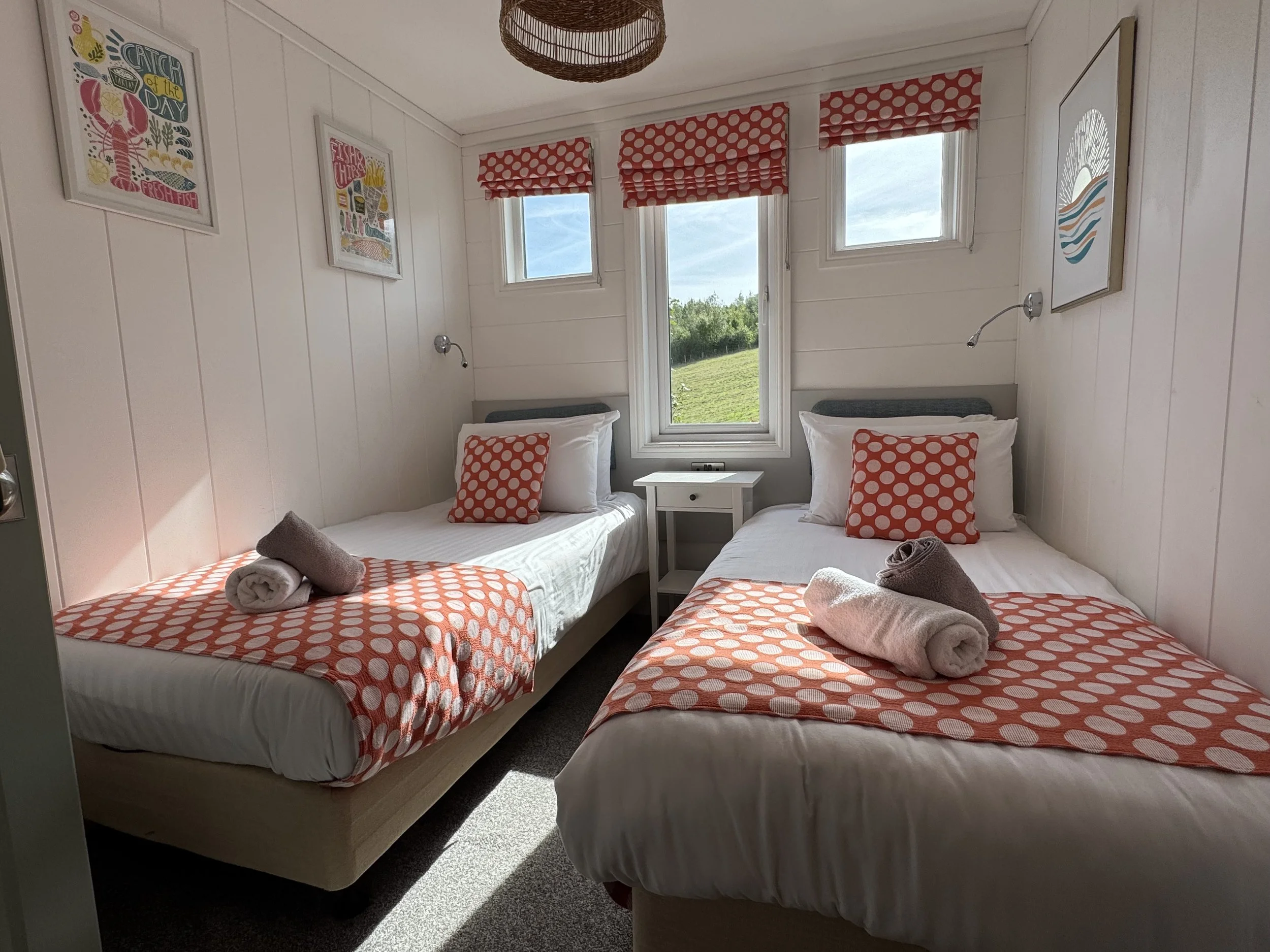 Twin bedroom inside Rockpool Lodge at Ladram Bay Holiday Park in East Devon