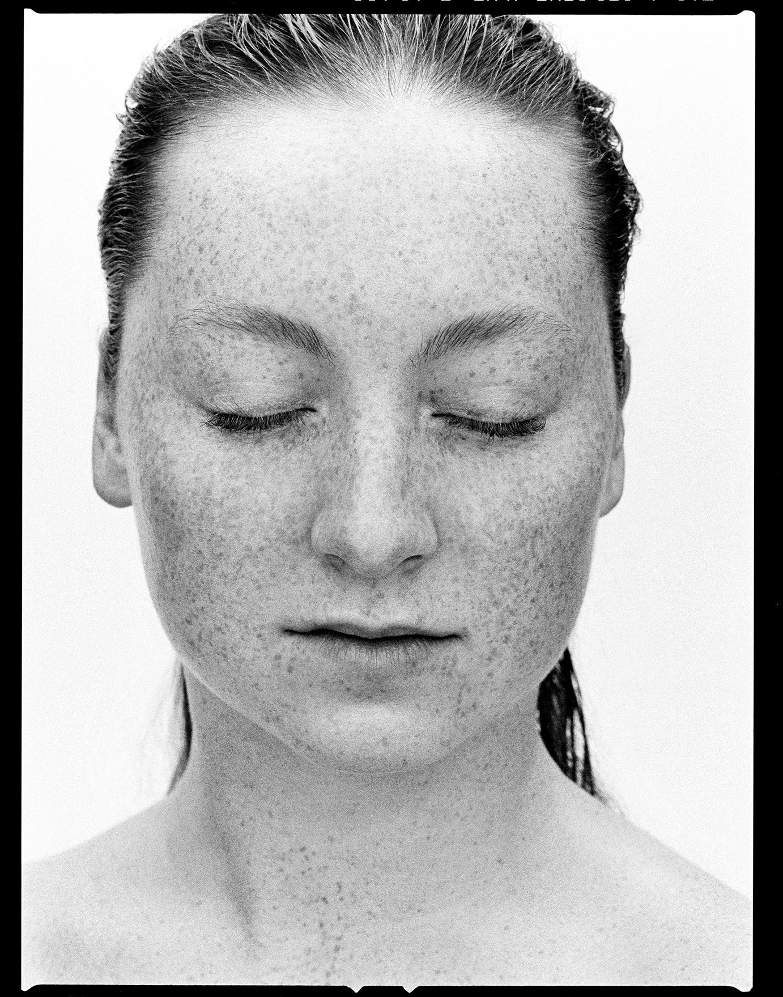 Unretouched portrait on film — freckles and natural skin texture