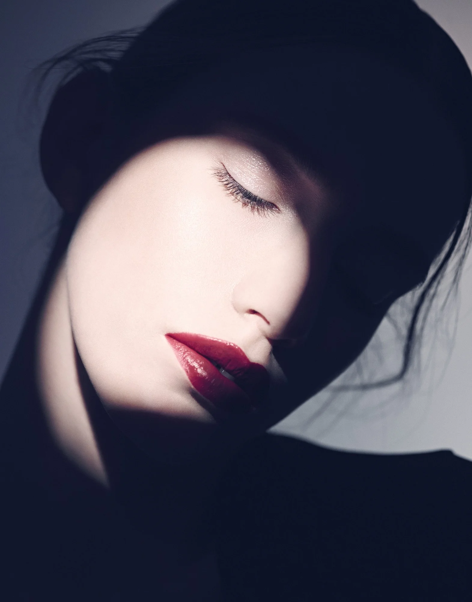 Beauty profile — red lip on dark background