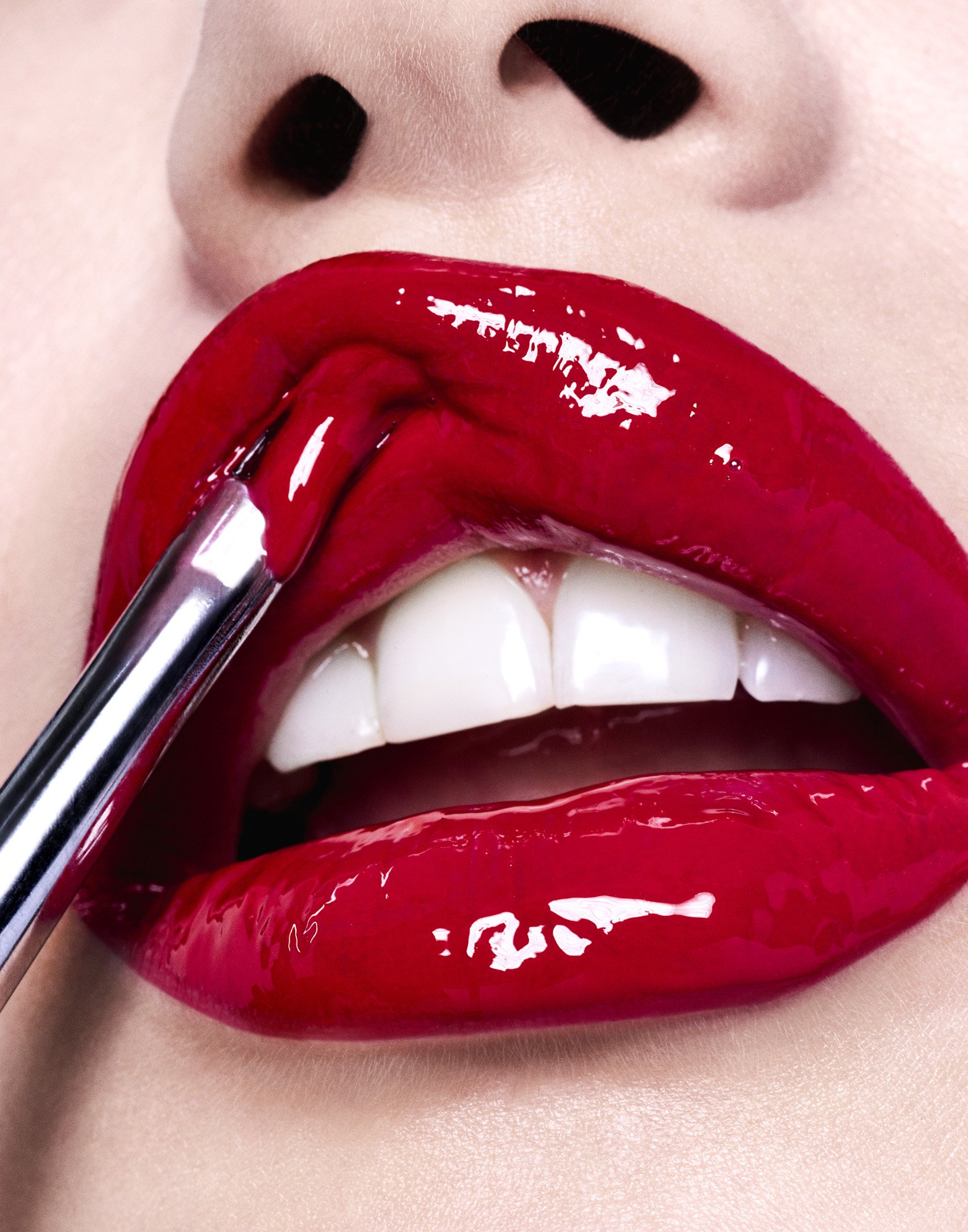 Red lip applicator close-up — product beauty photography