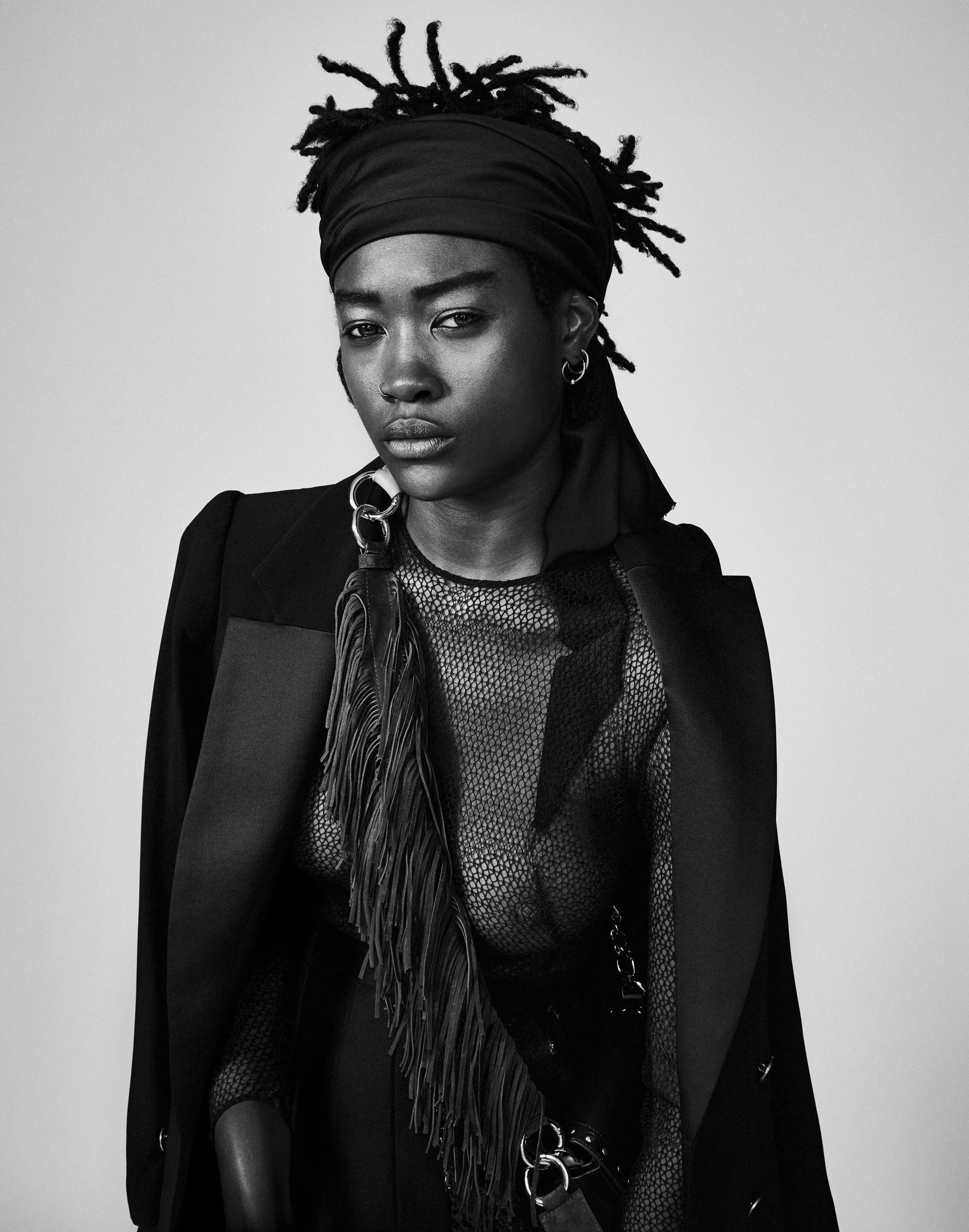 Black and white fashion portrait — direct gaze, studio precision