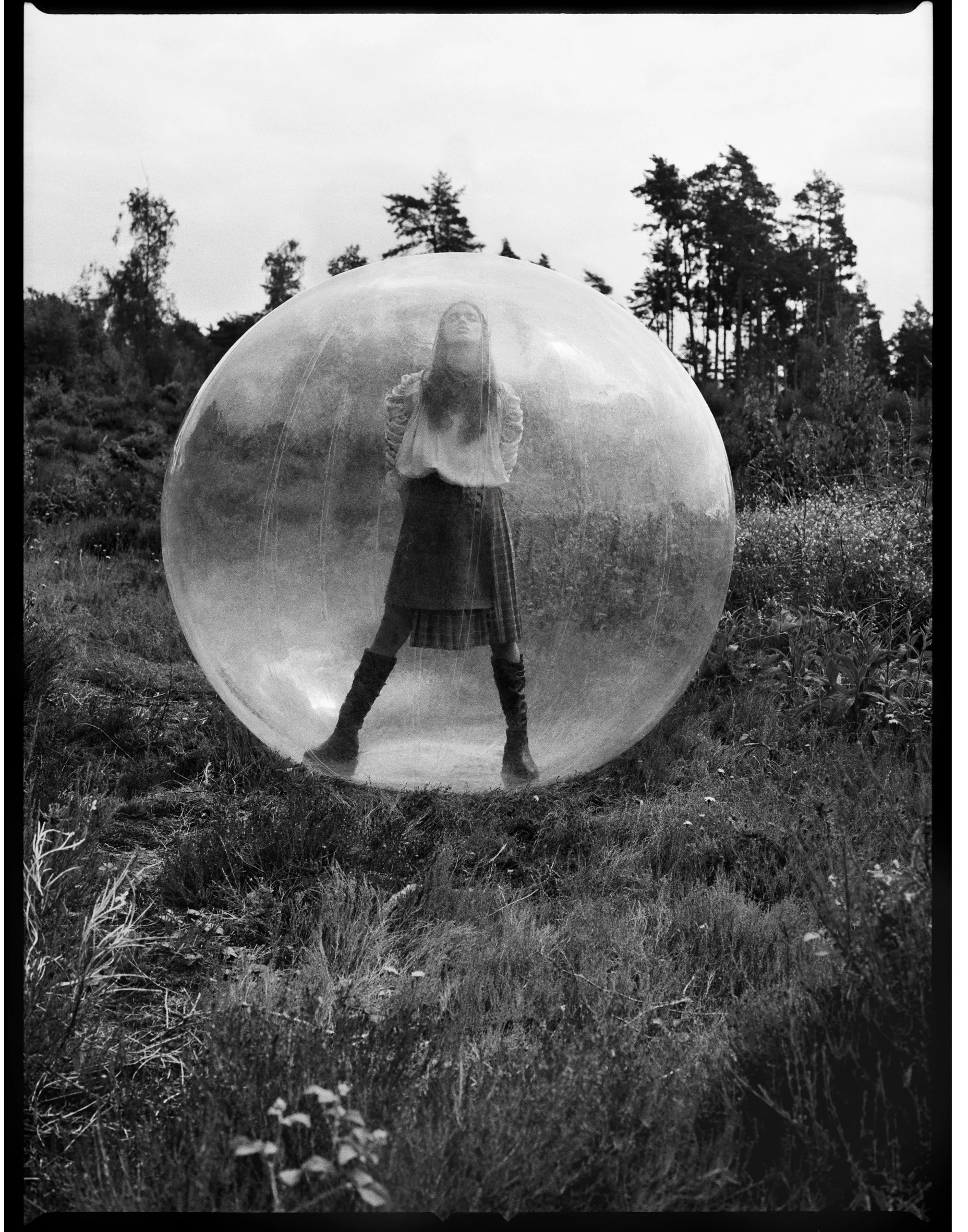 Fashion photography, surreal staging — the conceptual closer of the set