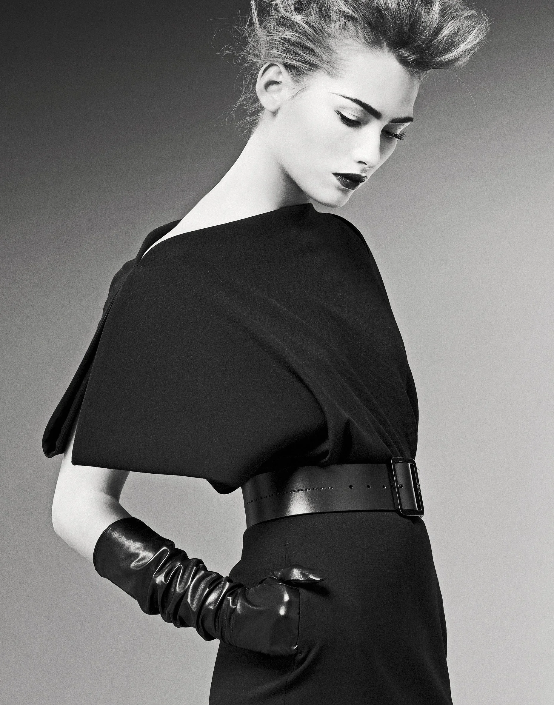 Black and white fashion portrait — sculptural collar, graphic styling
