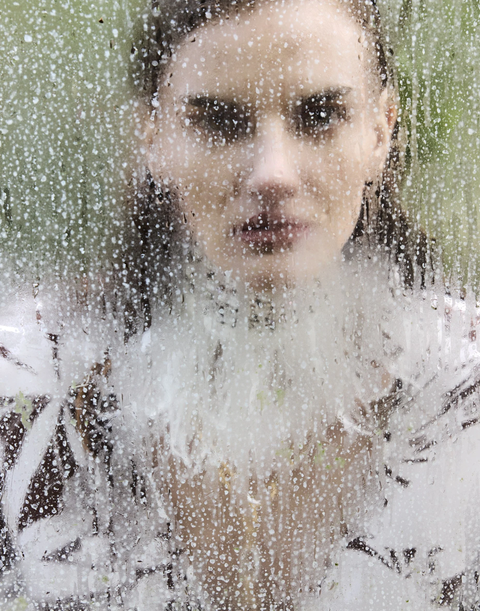 Fashion beauty crossover — face through water, editorial precision