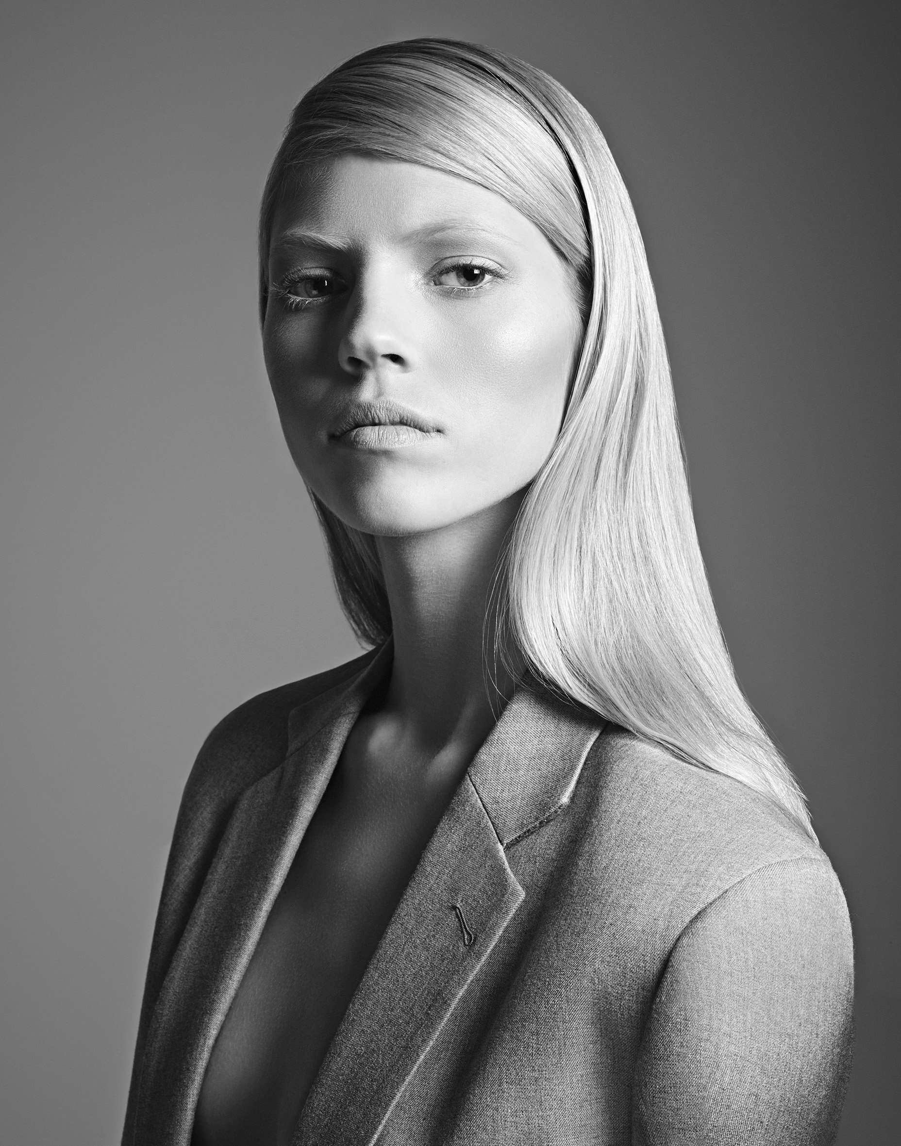 Black and white fashion portrait — sleek wet-look styling, studio precision