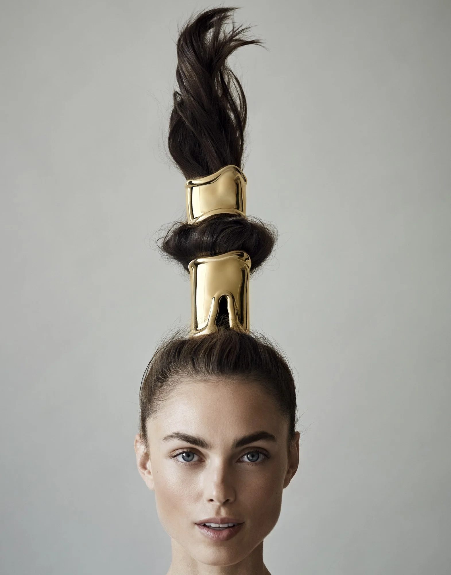 Gold hair cuff on a raised ponytail, hair jewellery photography by Benjamin Kaufmann