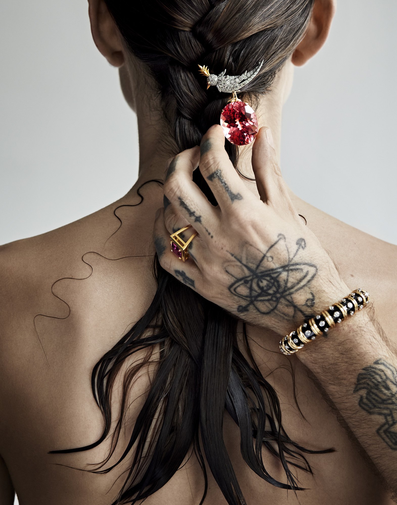 Red gem hair clip and tattooed hand, hair jewellery photography by Benjamin Kaufmann