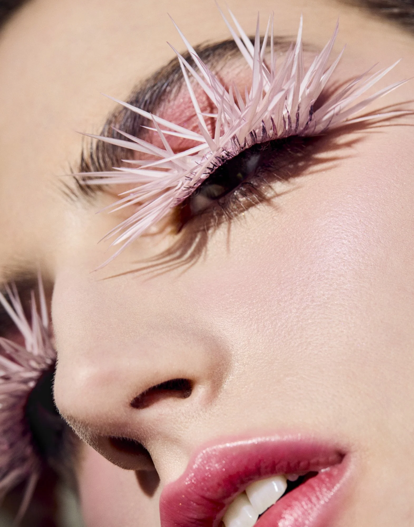 Pink feather lashes and glossy lip, creative make-up photography by Benjamin Kaufmann