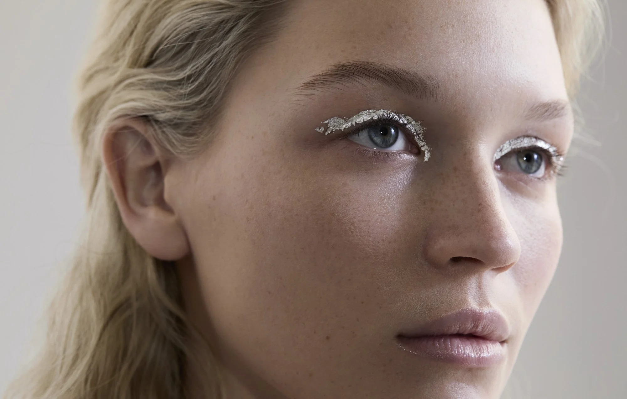 Silver glitter eyeliner close-up, eye make-up photography London by Benjamin Kaufmann