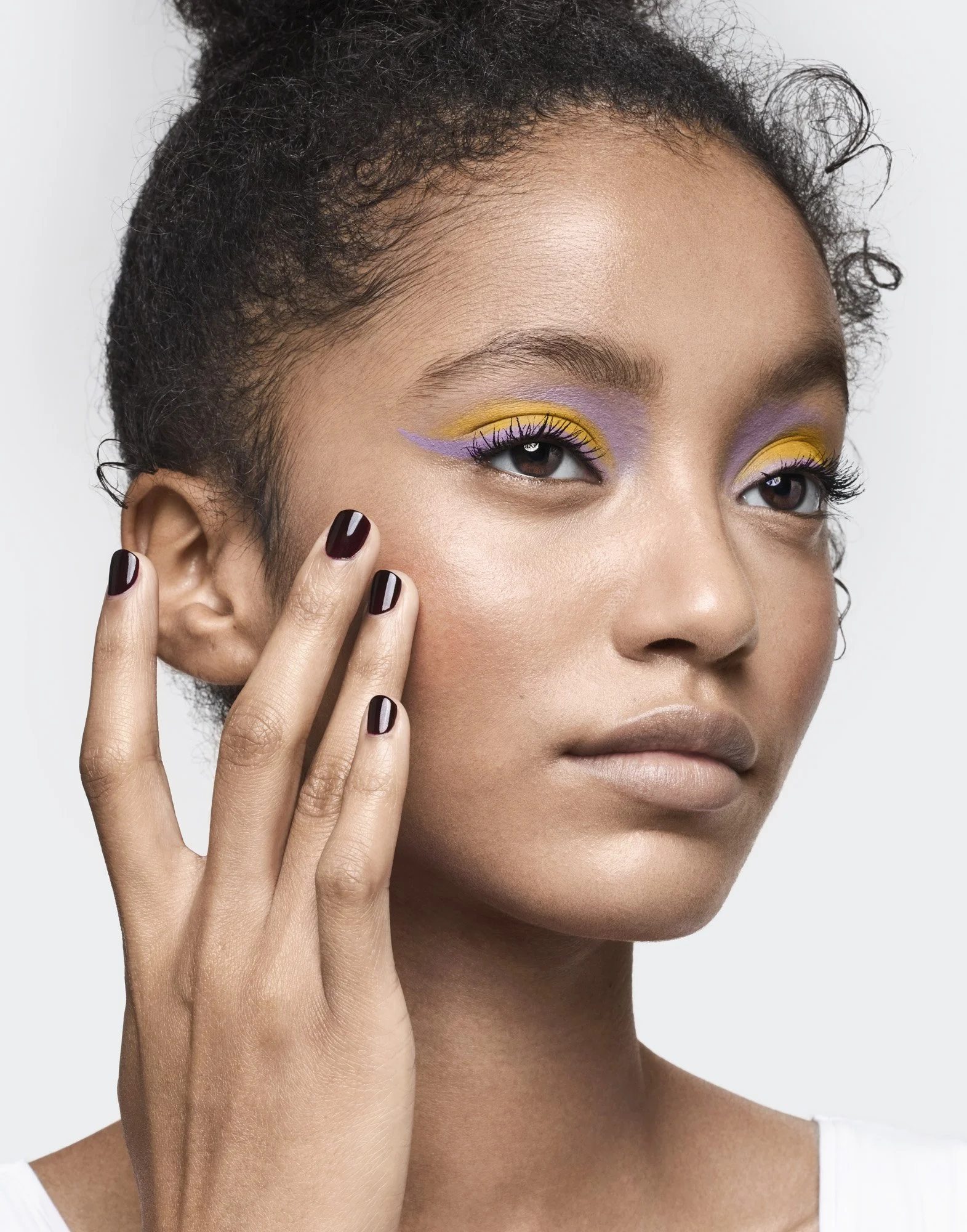 Yellow and lilac graphic eyeliner, make-up photographer London Benjamin Kaufmann