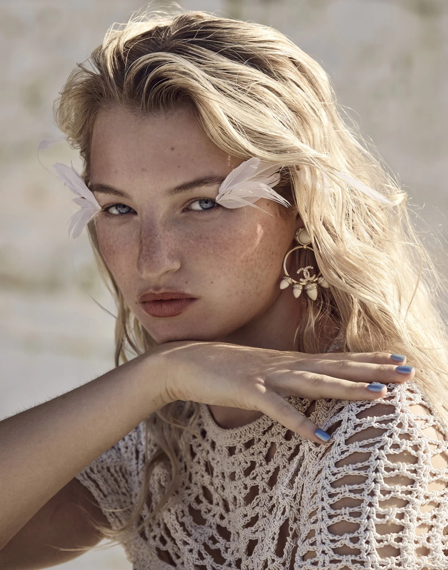 Feather lashes, blonde hair in natural light, editorial beauty photography by Benjamin Kaufmann