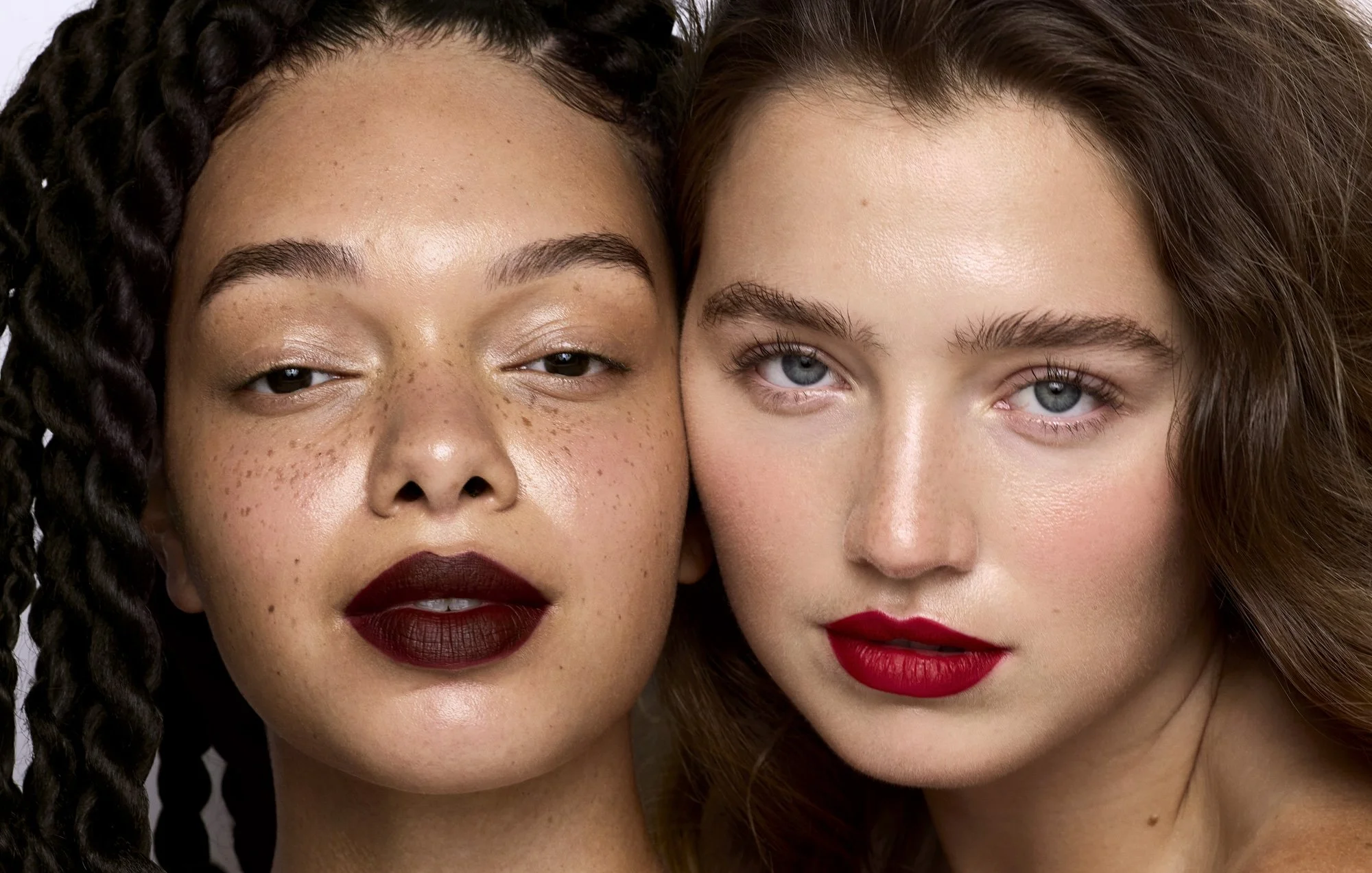 Burgundy and red lipstick on two skin tones, lipstick photography London by Benjamin Kaufmann