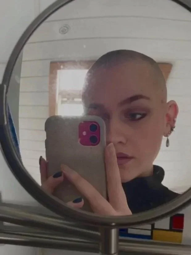River the proofreader with a buzz cut in the mirror.