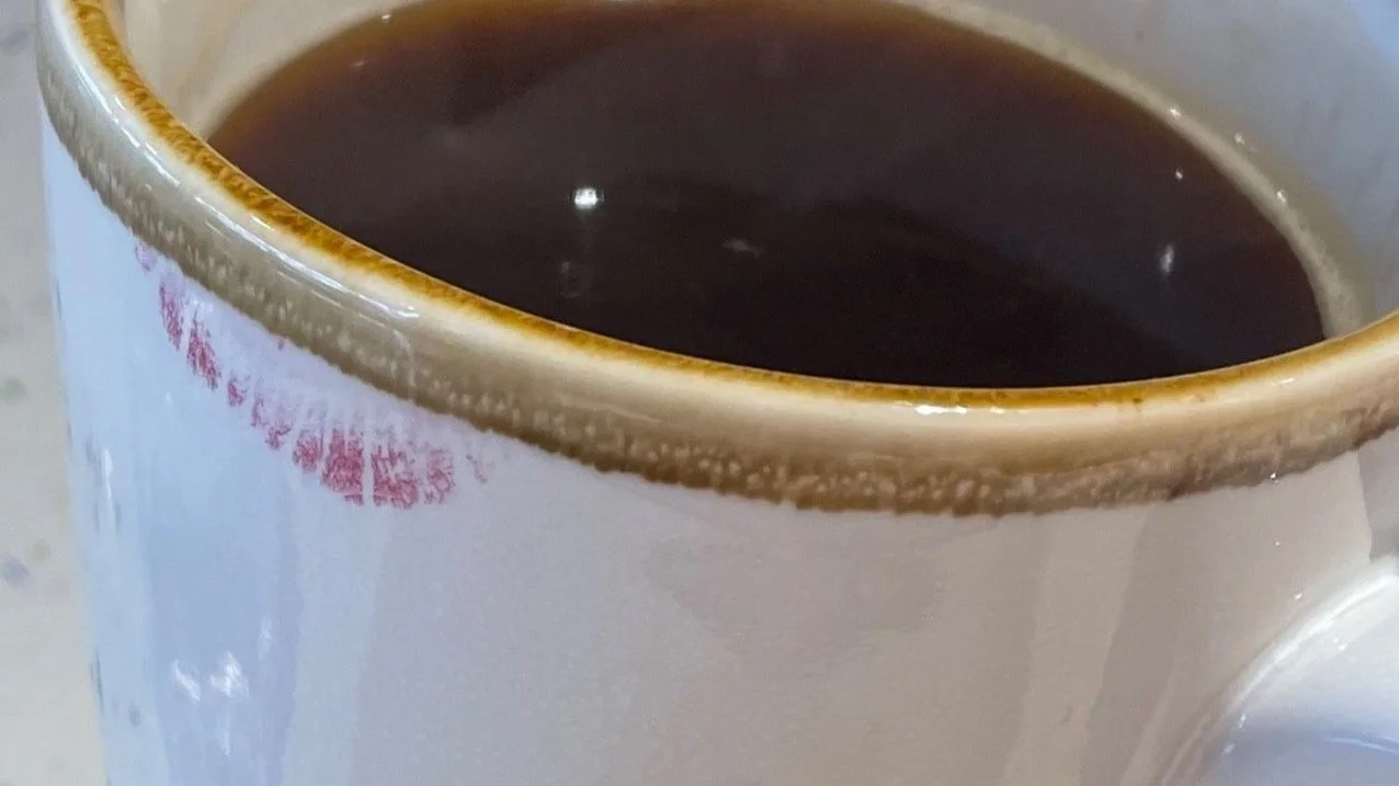 River's cup of decaf coffee whilst on vacation.