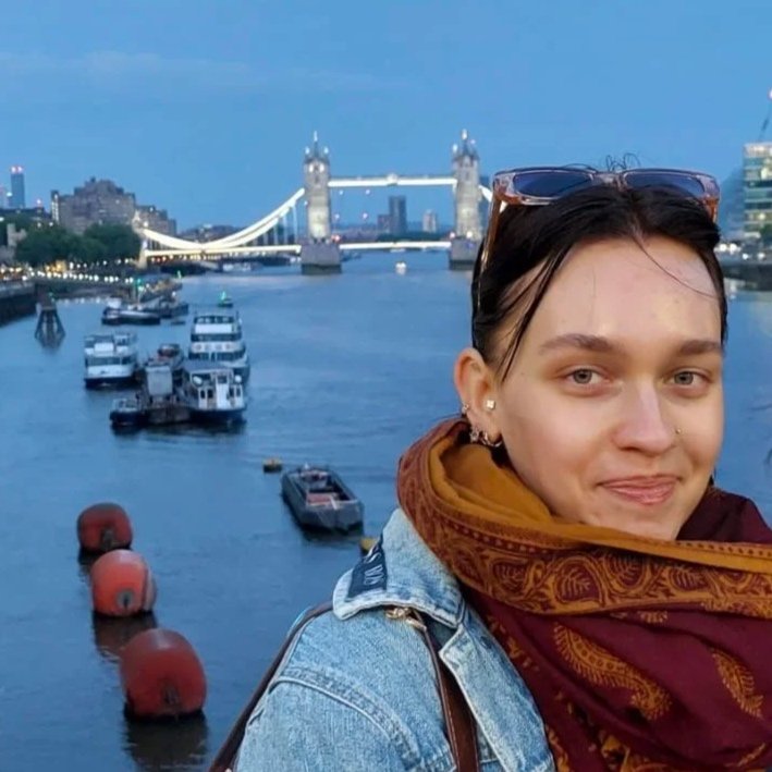 River the co-producer in London in front of the Tower Bridge.