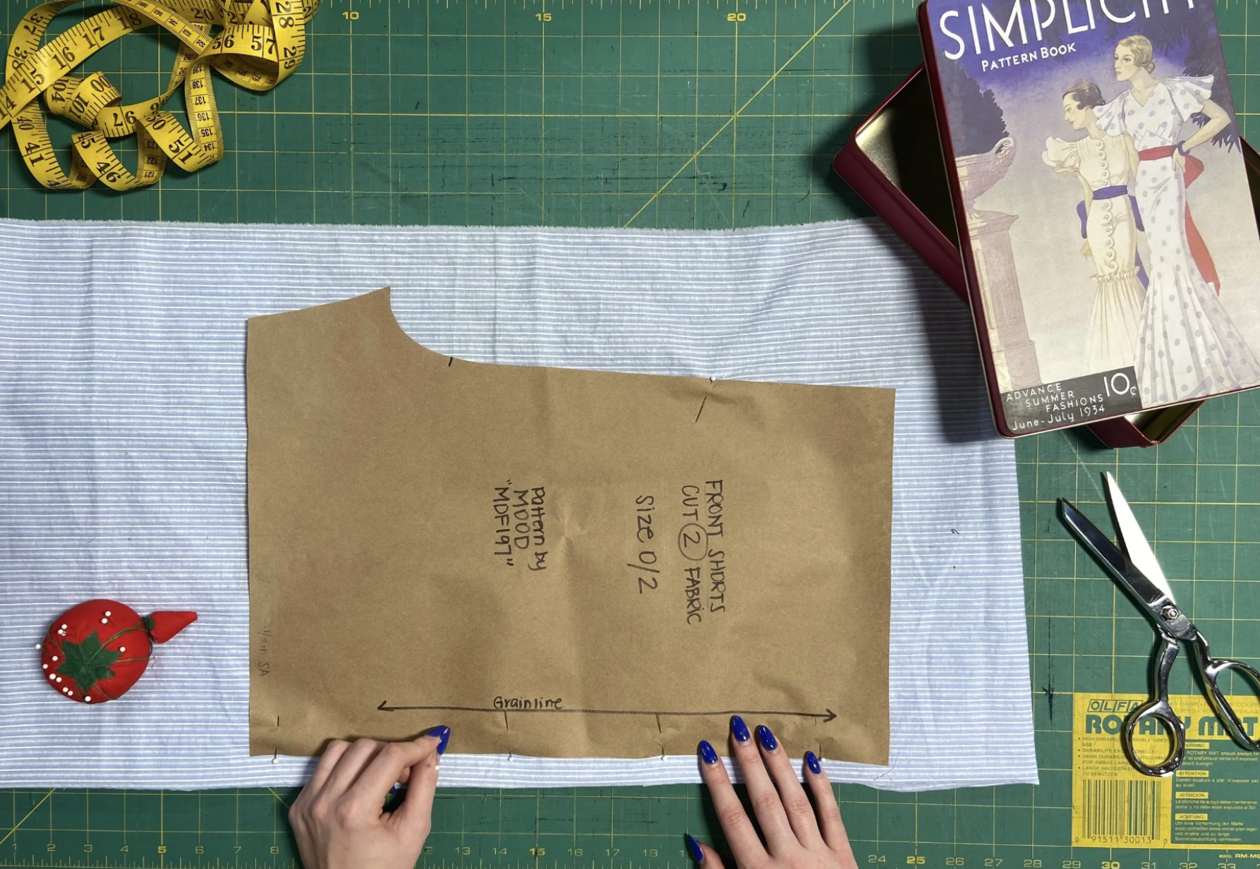 Close up of a pattern pinned to fabric