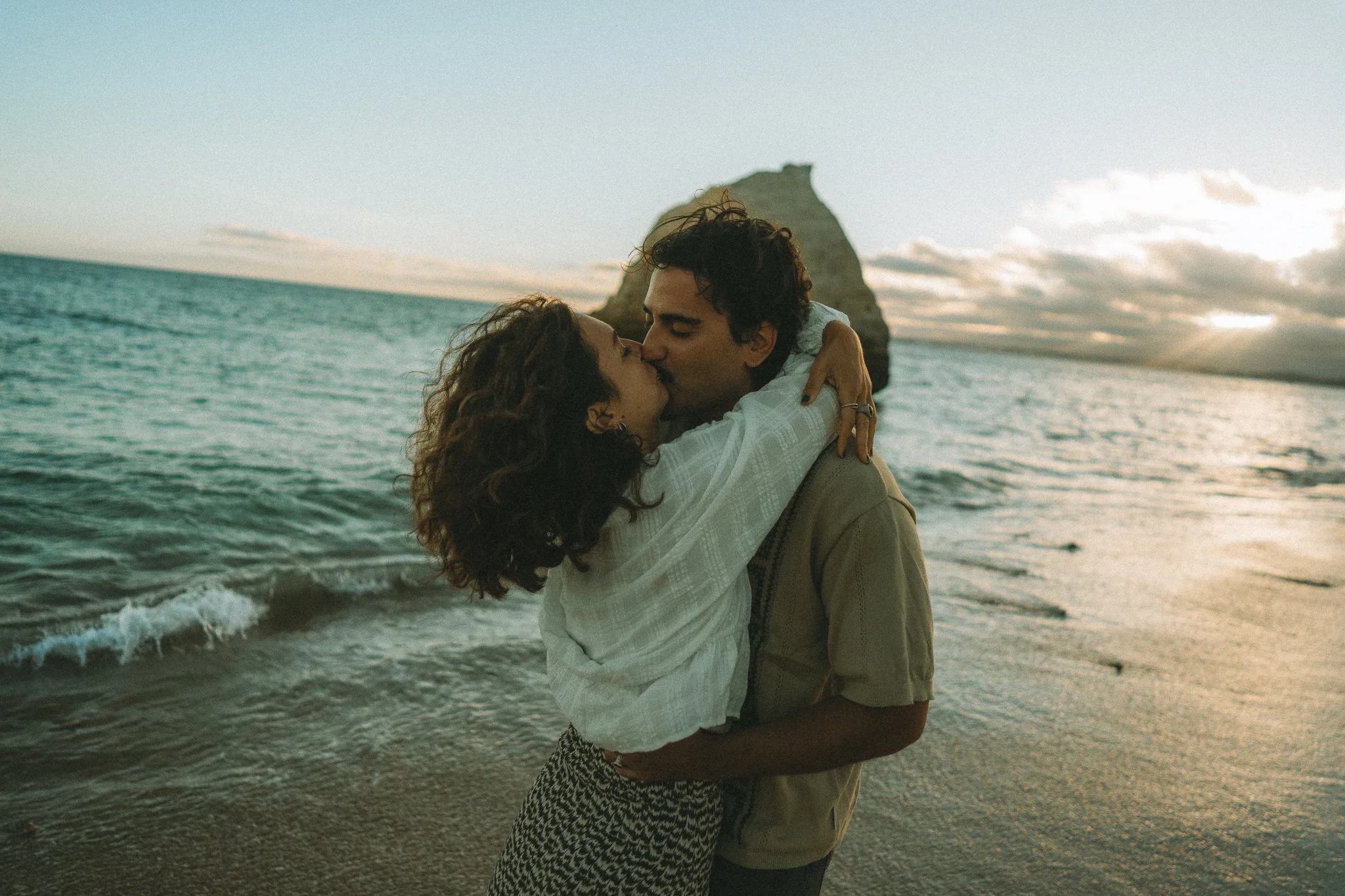 Candid couple photoshoot at golden hour sunset in Algarve