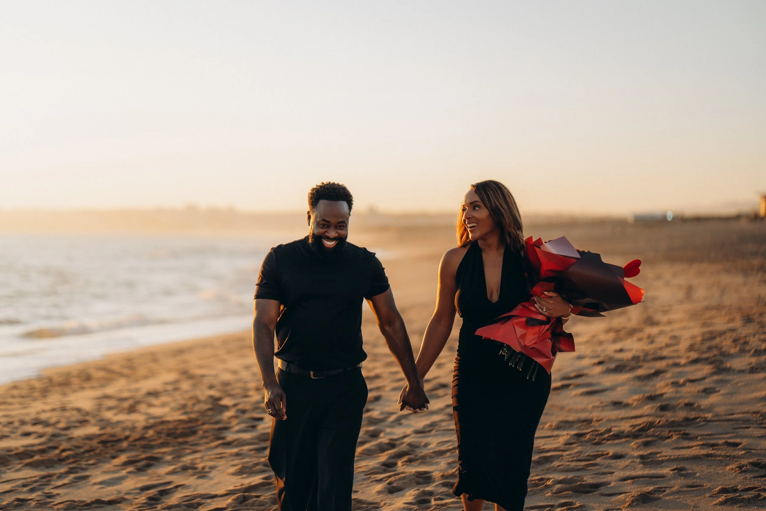 A couple walking after he proposed her in the Algarve. Proposal Photoshoot