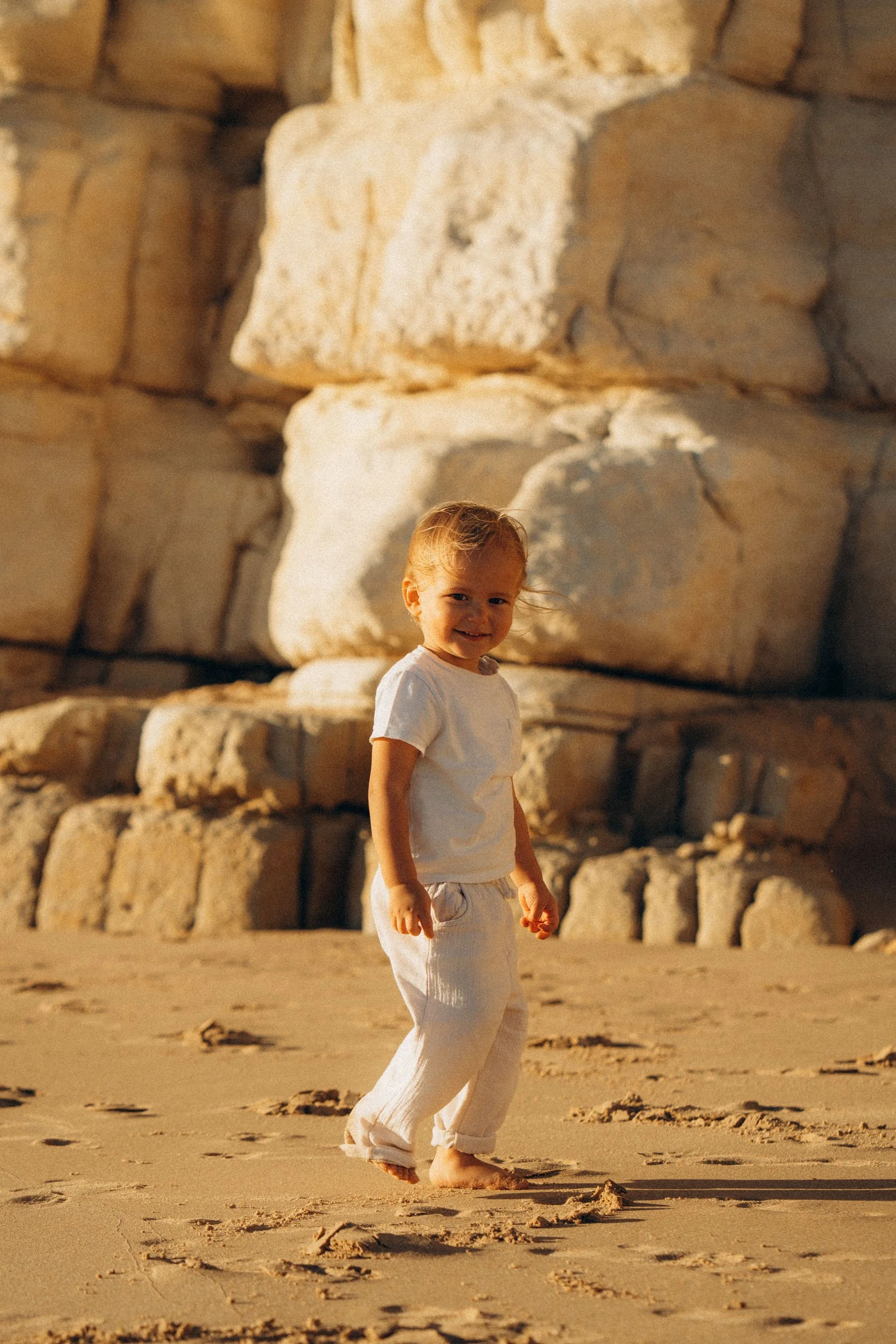 Child portrait captured during a family photoshoot at Porto de Mos beach, Lagos
