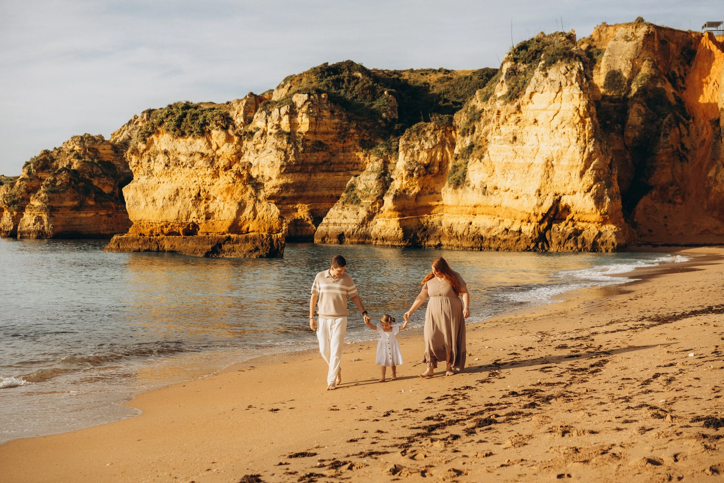 A family having fun at Praia Dona Ana, Lagos. Algarve
