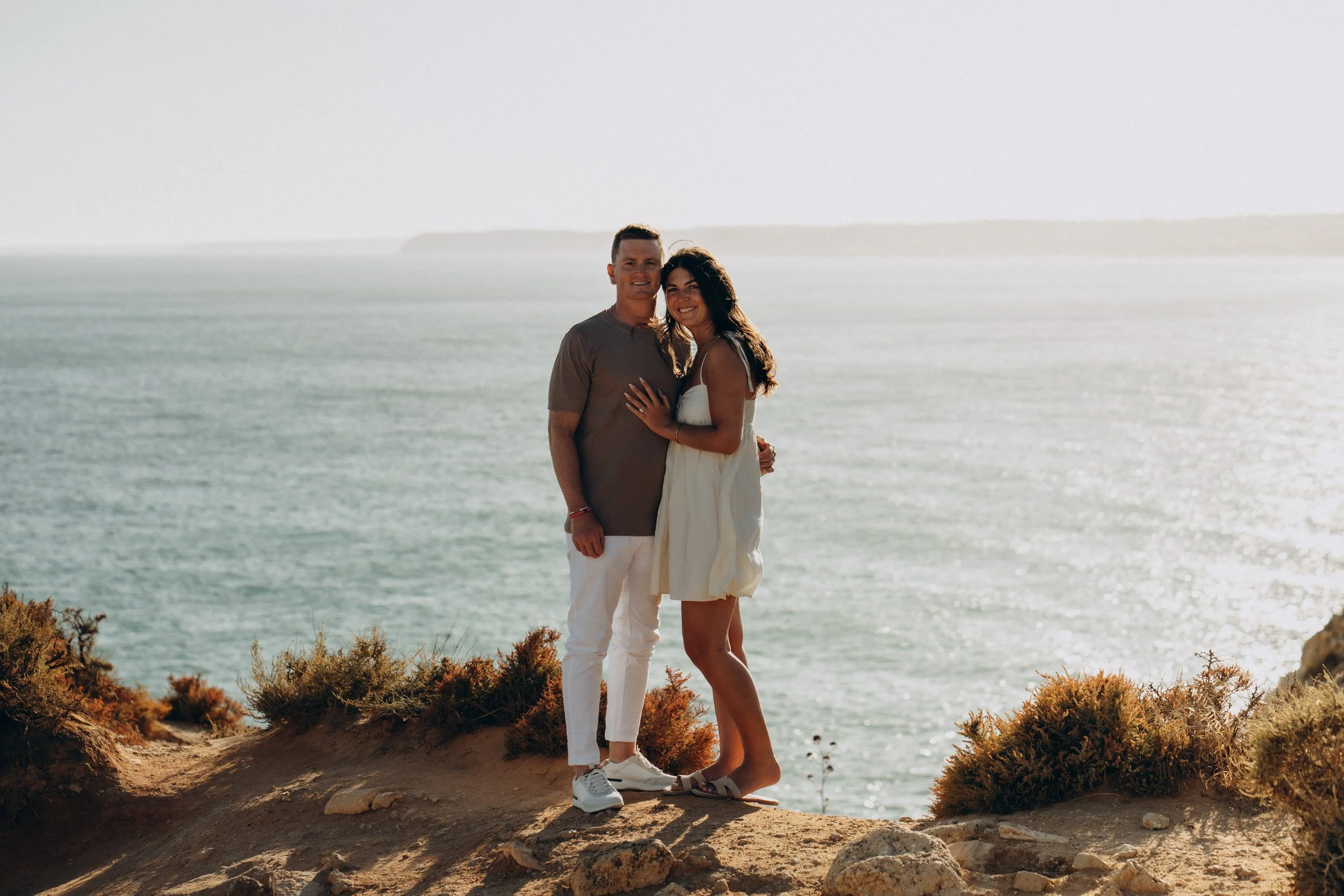 Classic but natural portrait overlooking the Atlantic. Balanced composition, clean background, golden hour glow.
