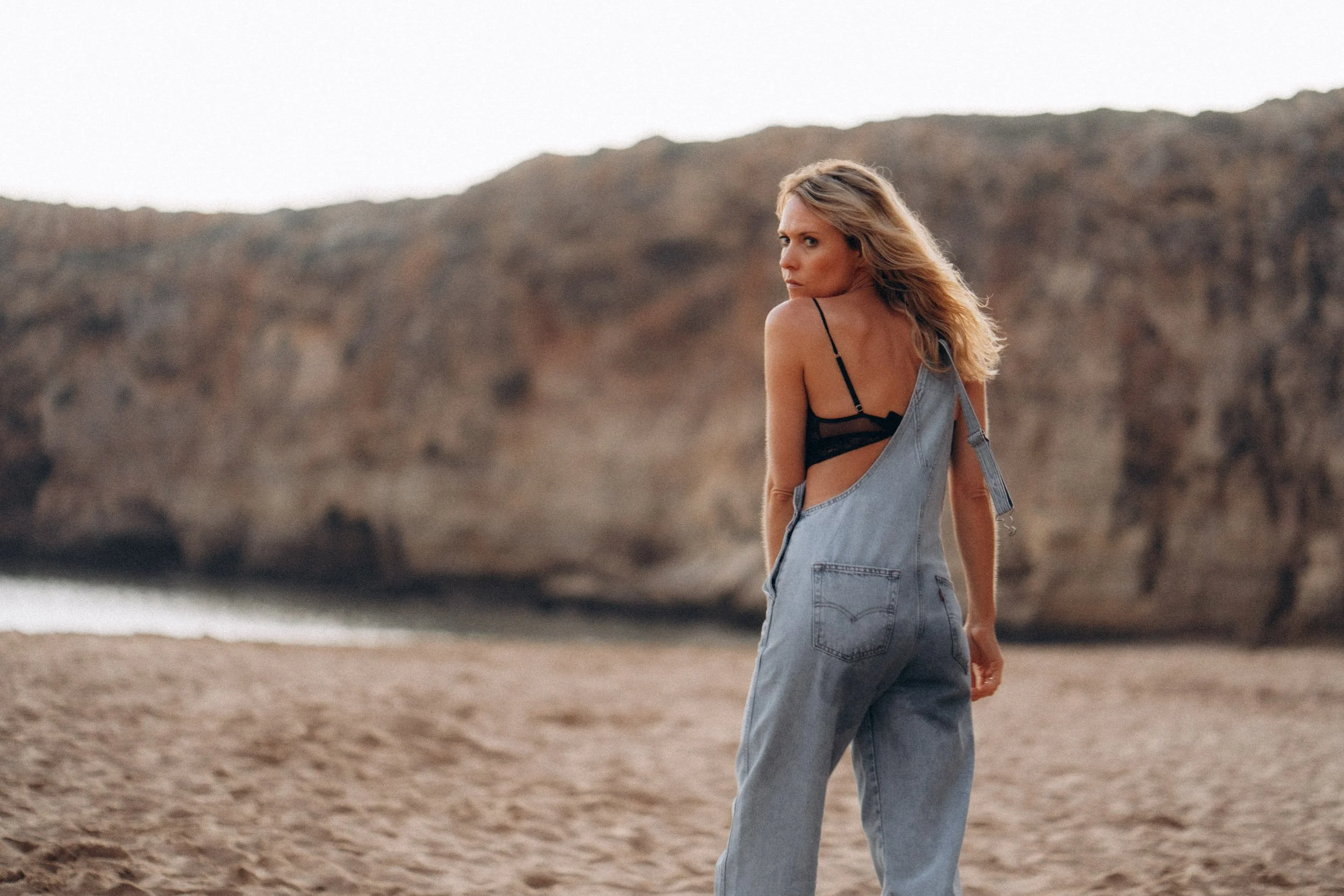 Creative lifestyle portrait walking on Beliche beach — modern cinematic photography Algarve